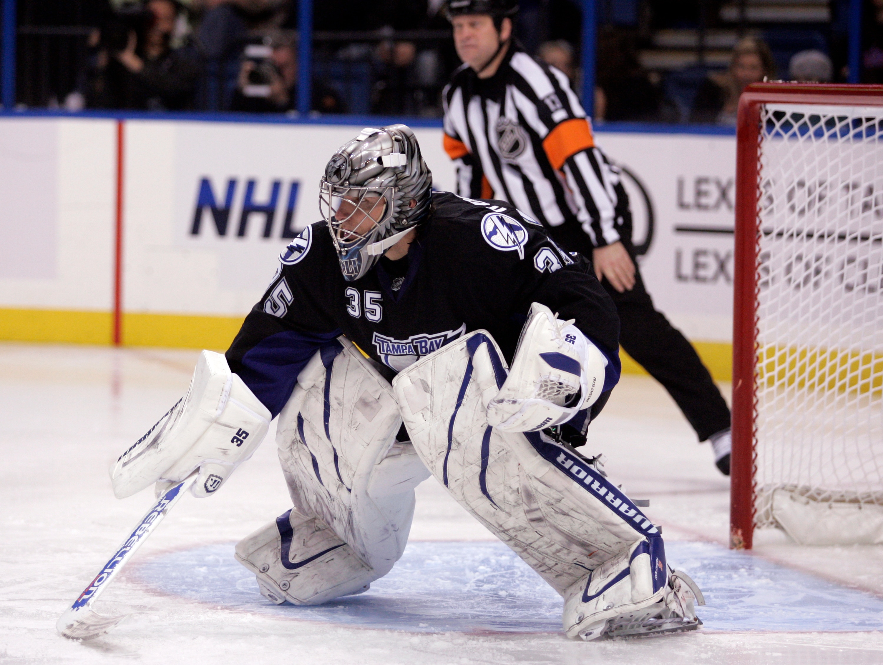 TAMPA, FL - JANUARY 25: Dwayne Roloson #35 of the Tampa Bay Lightning protects the net against the Toronto Maple Leafs at St. Pete Times Forum on January 25, 2011 in Tampa, Florida. The Lightning defeated the Leafs 2-0. (Photo by Justin K. Aller/Getty Ima