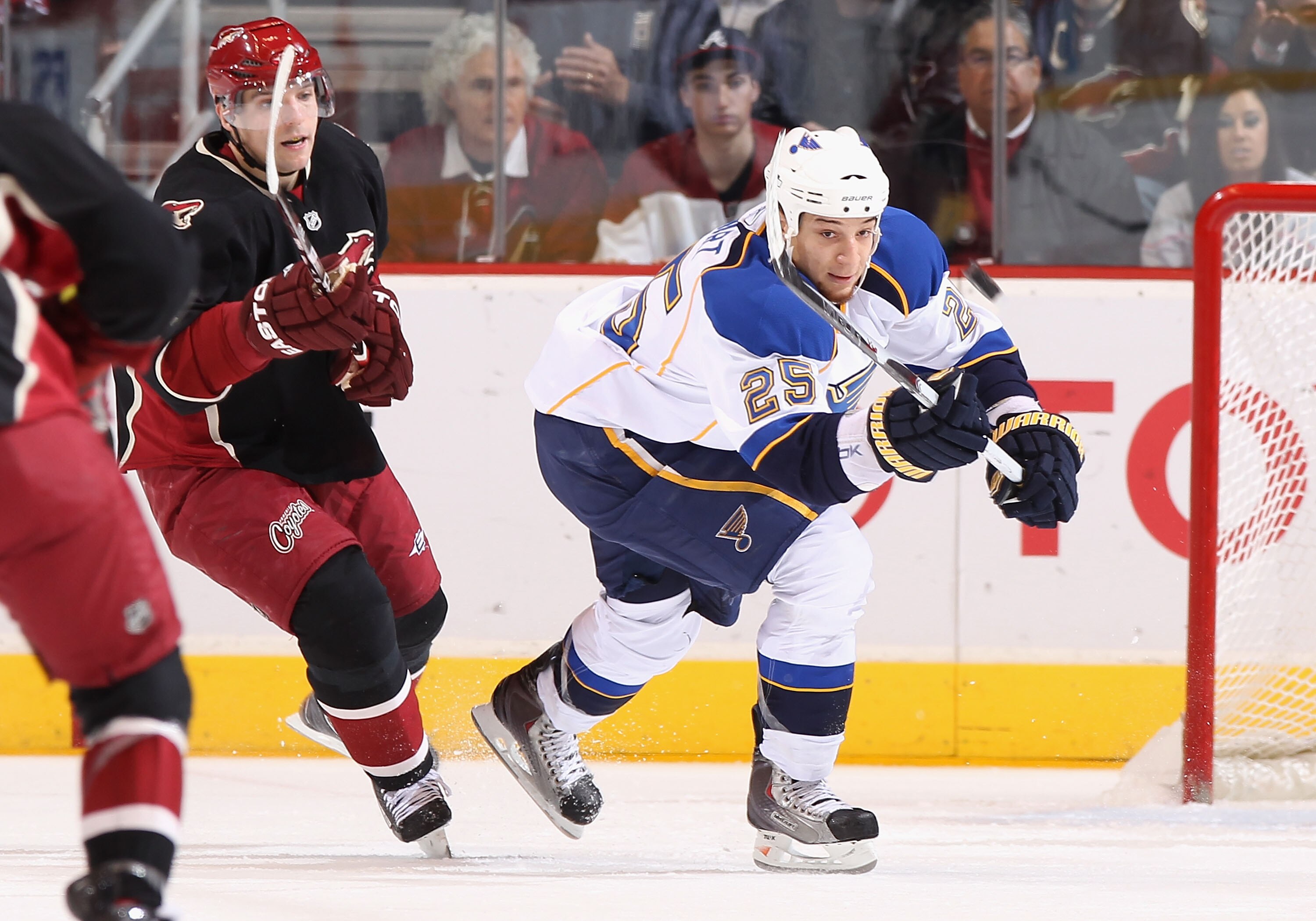 GLENDALE, AZ - MARCH 22:  Chris Stewart #25 of the St. Louis Blues flips the puck past Radim Vrbata #17 of the Phoenix Coyotes during the NHL game at Jobing.com Arena on March 22, 2011 in Glendale, Arizona. The Coyotes defeated the Blues 2-1.  (Photo by C