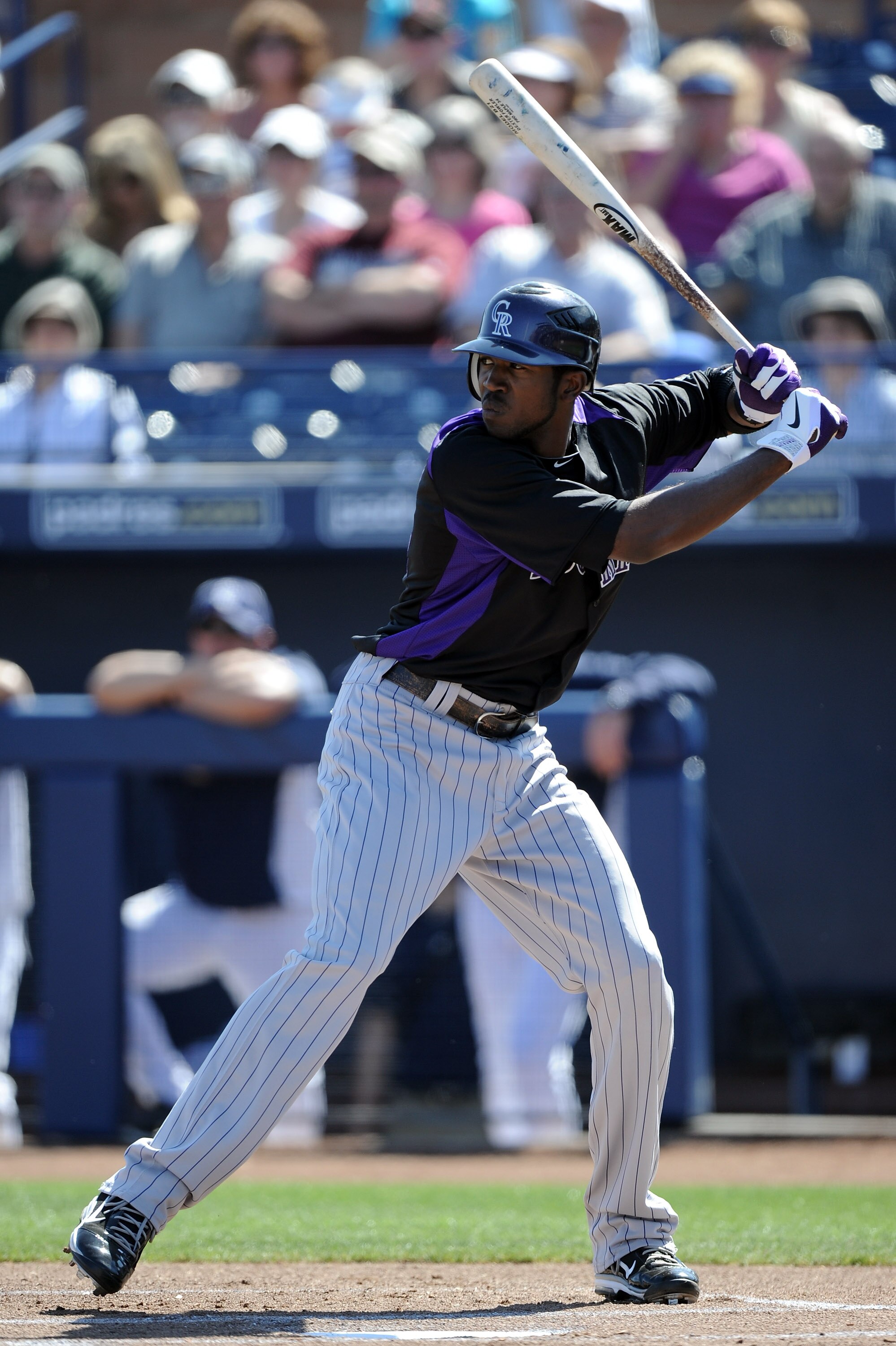 PEORIA, AZ - MARCH 02:  Dexter Fowler #24 of the Colorado Rockies at bat against the San Diego Padres during spring training at Peoria Stadium on March 2, 2011 in Peoria, Arizona.  (Photo by Harry How/Getty Images)