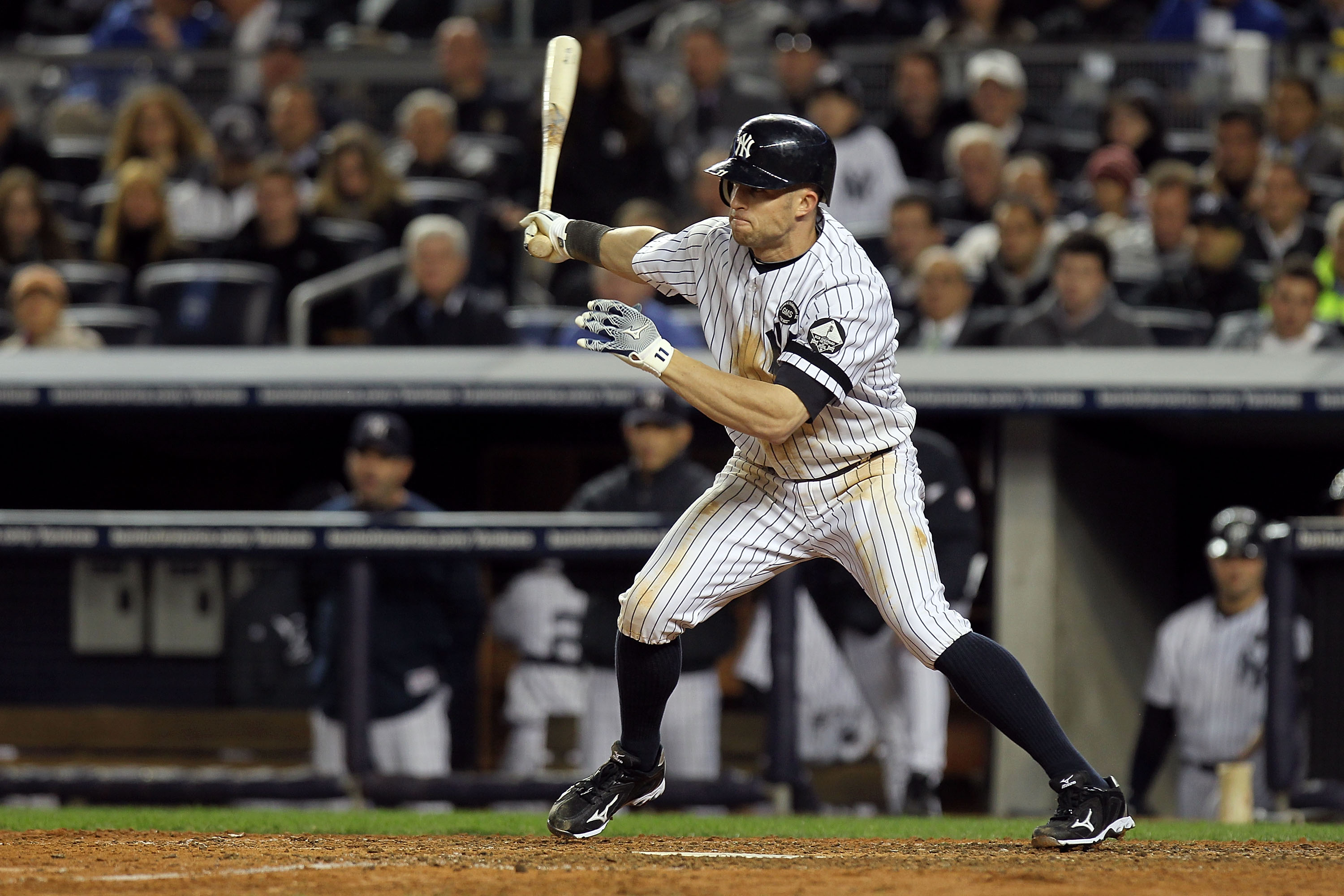 NEW YORK - OCTOBER 18:  Brett Gardner #11 of the New York Yankees hits a single in the bottom of the sixth inning against the Texas Rangers in Game Three of the ALCS during the 2010 MLB Playoffs at Yankee Stadium on October 18, 2010 in New York, New York.