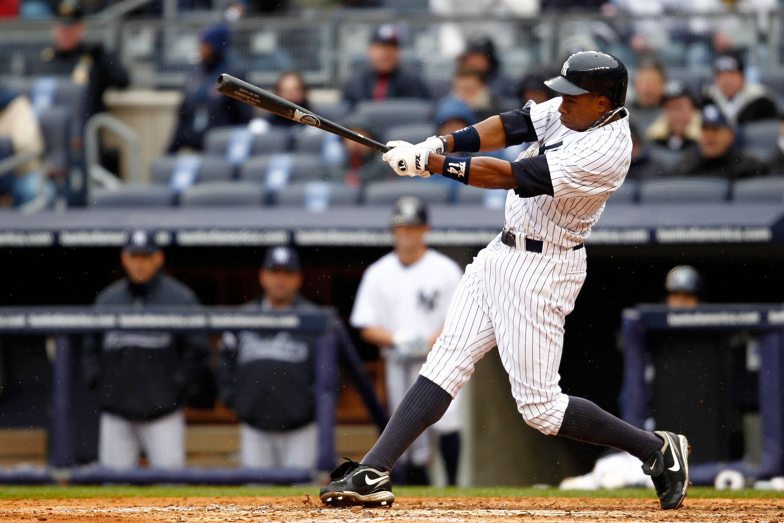 NEW YORK, NY - MARCH 31:  Curtis Granderson #14 of the New York Yankees homers to right field in the seventh inning against the Detroit Tigers on Opening Day at Yankee Stadium on March 31, 2011 in the Bronx borough of New York City. The Yankees won 6-3 in