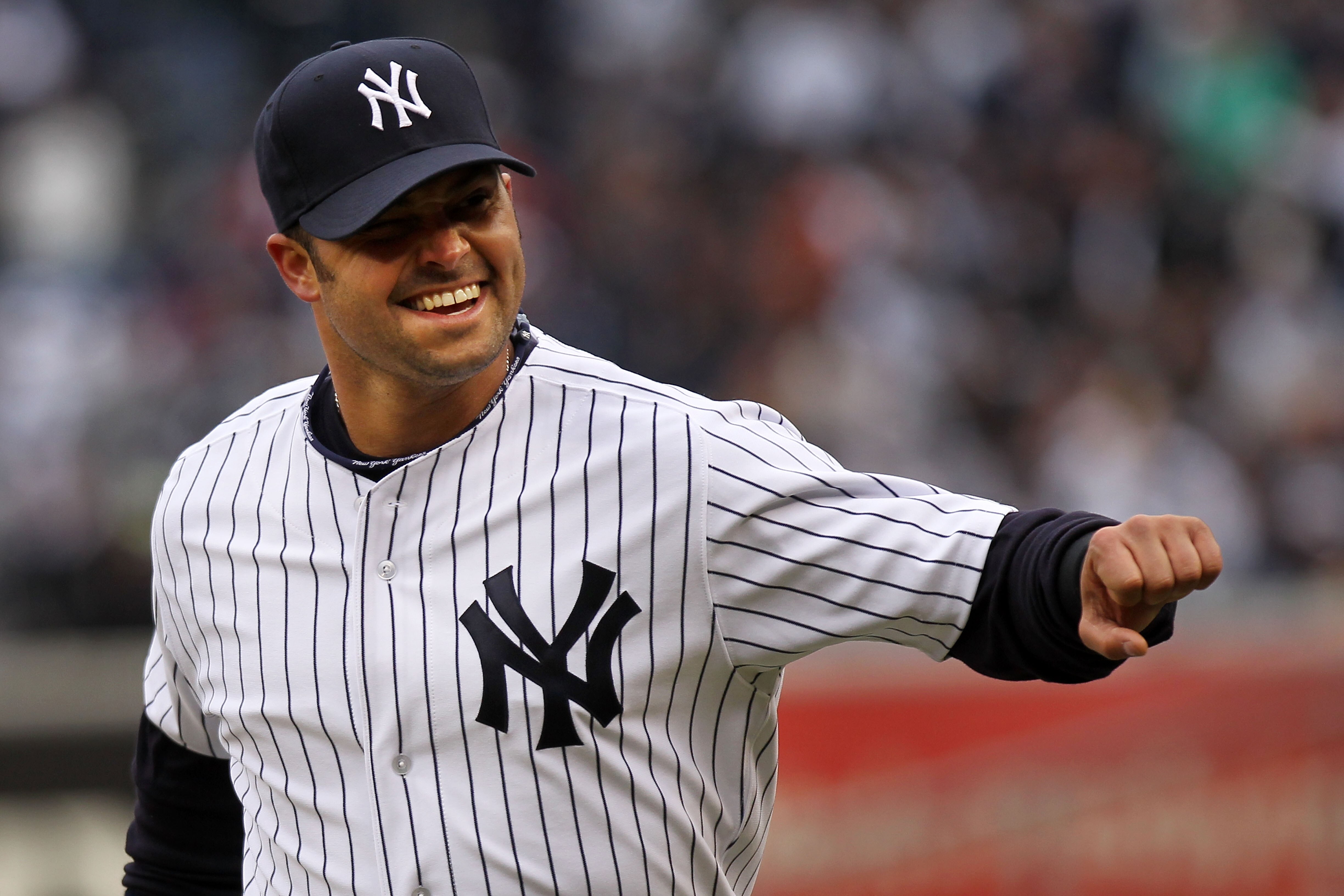 NEW YORK, NY - MARCH 31:  Nick Swisher #33 of the New York Yankees celebrates during the first inning against the Detroit Tigers on Opening Day at Yankee Stadium on March 31, 2011 in the Bronx borough of New York City. (Photo by Nick Laham/Getty Images)