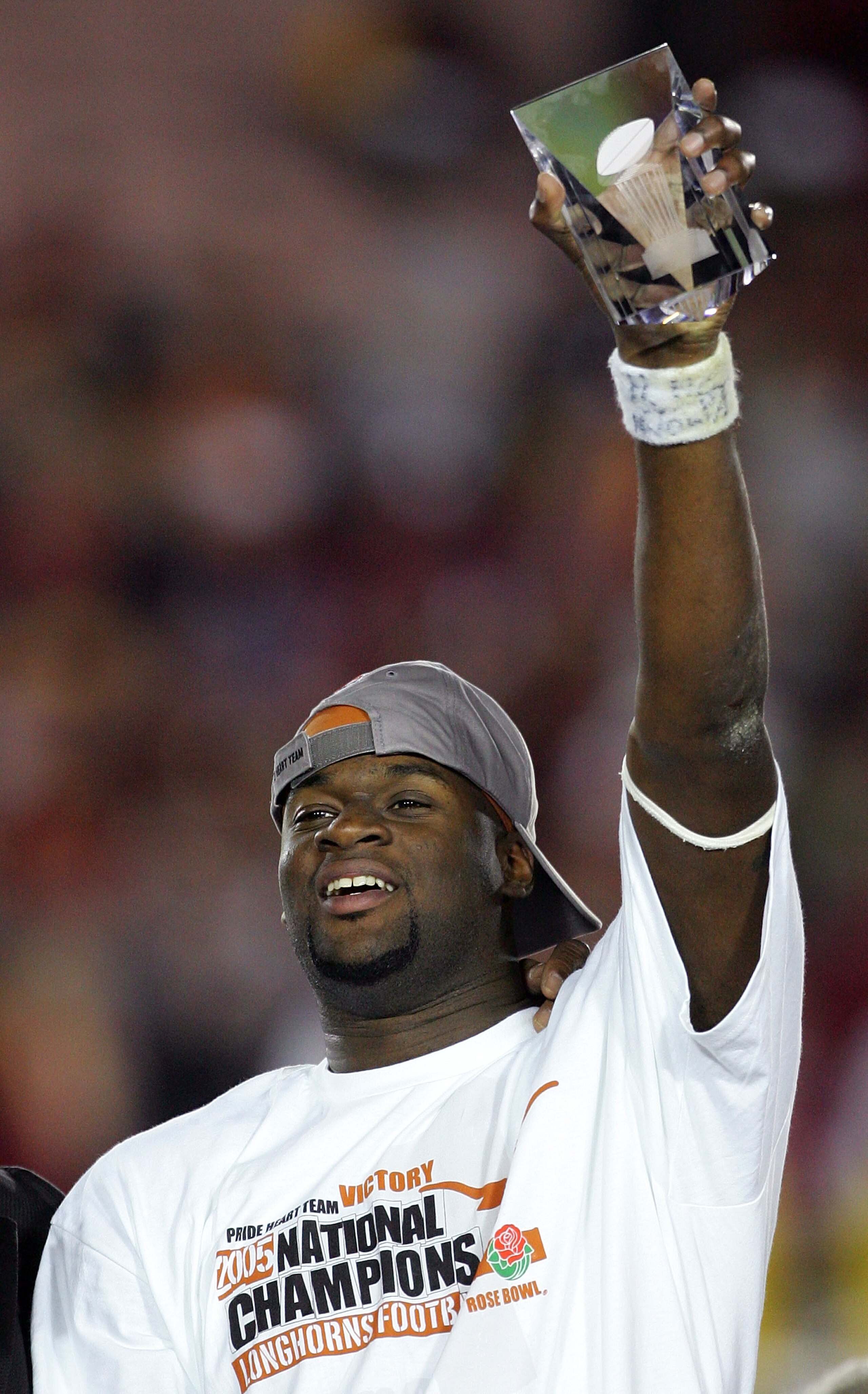 PASADENA, CA - JANUARY 04:  Quarterback Vince Young #10 of the Texas Longhorns holds up the award for offensive player of the game after defeating the USC Trojans in the final moments of the BCS National Championship Rose Bowl Game at the Rose Bowl on Jan