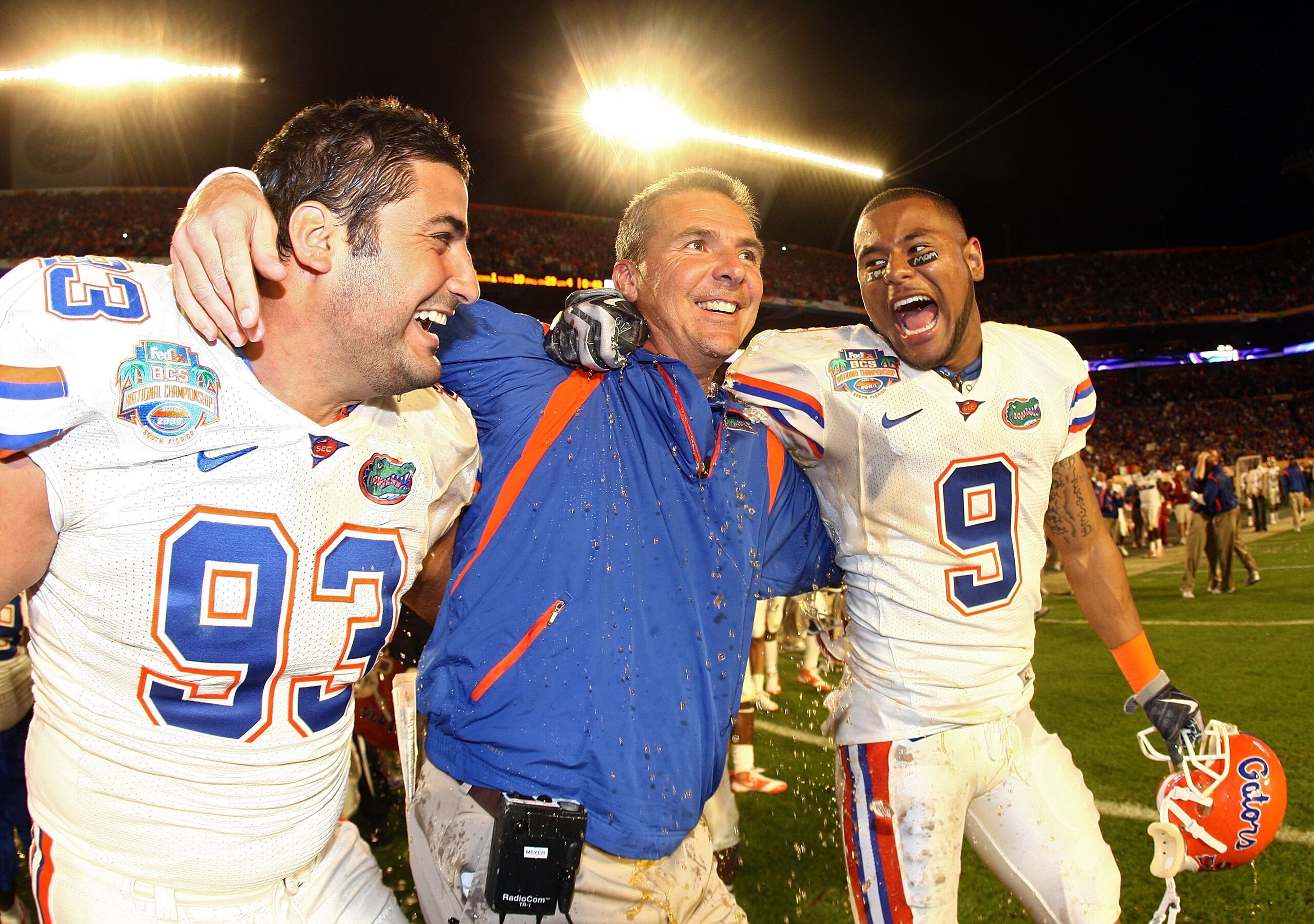 MIAMI - JANUARY 08:  Head coach Urban Meyer of the Florida Gators gets gatorade dumped on him as Javier Estopinan #93 and Louis Murphy #9 look on towards the end of the game against the Oklahoma Sooners in the FedEx BCS National Championship Game at Dolph