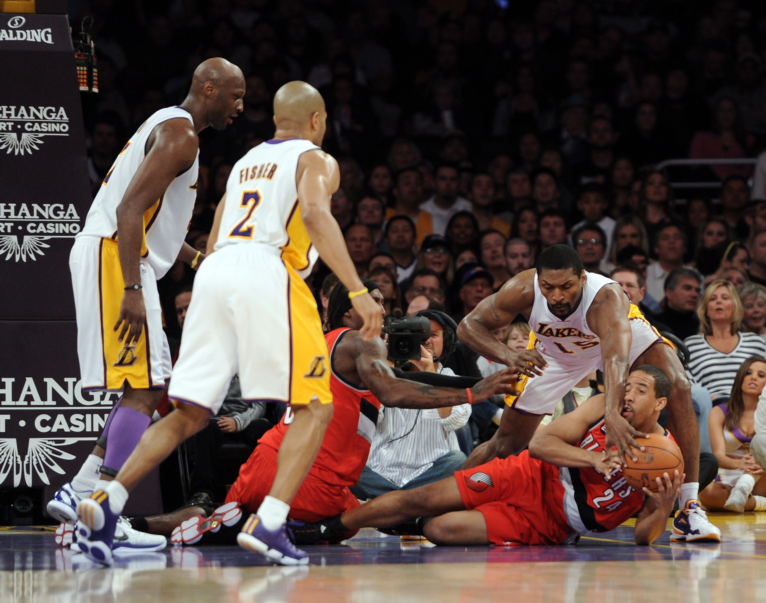 LOS ANGELES, CA - MARCH 20:  Andre Miller #24 of the Portland Trail Blazers and Ron Artest #15 of the Los Angeles Lakers chase a loose ball at the Staples Center on March 20, 2011 in Los Angeles, California.  NOTE TO USER: User expressly acknowledges and
