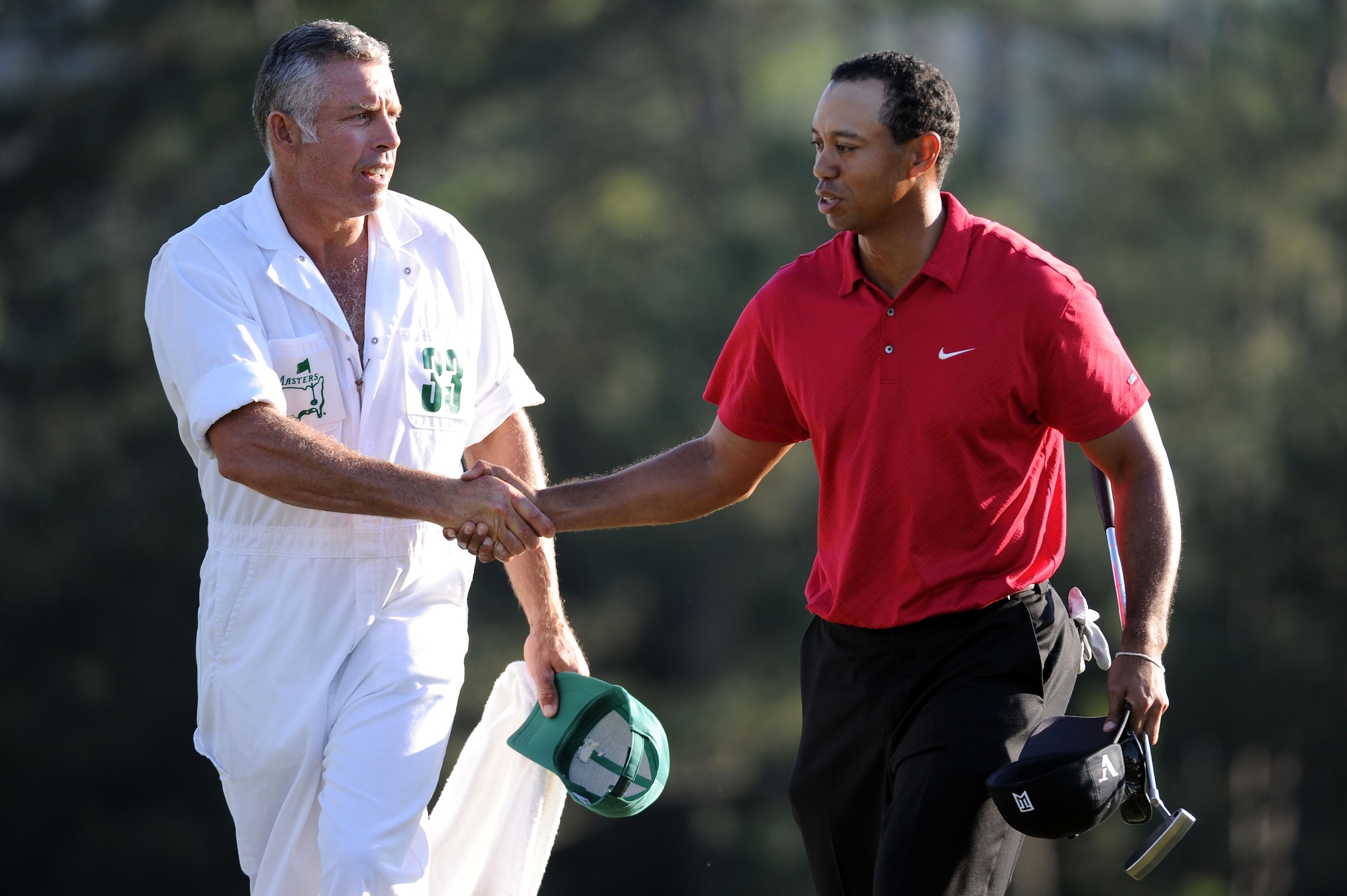 AUGUSTA, GA - APRIL 11:  Tiger Woods walks off the 18th green with his caddie Steve Williams during the final round of the 2010 Masters Tournament at Augusta National Golf Club on April 11, 2010 in Augusta, Georgia.  (Photo by Harry How/Getty Images)
