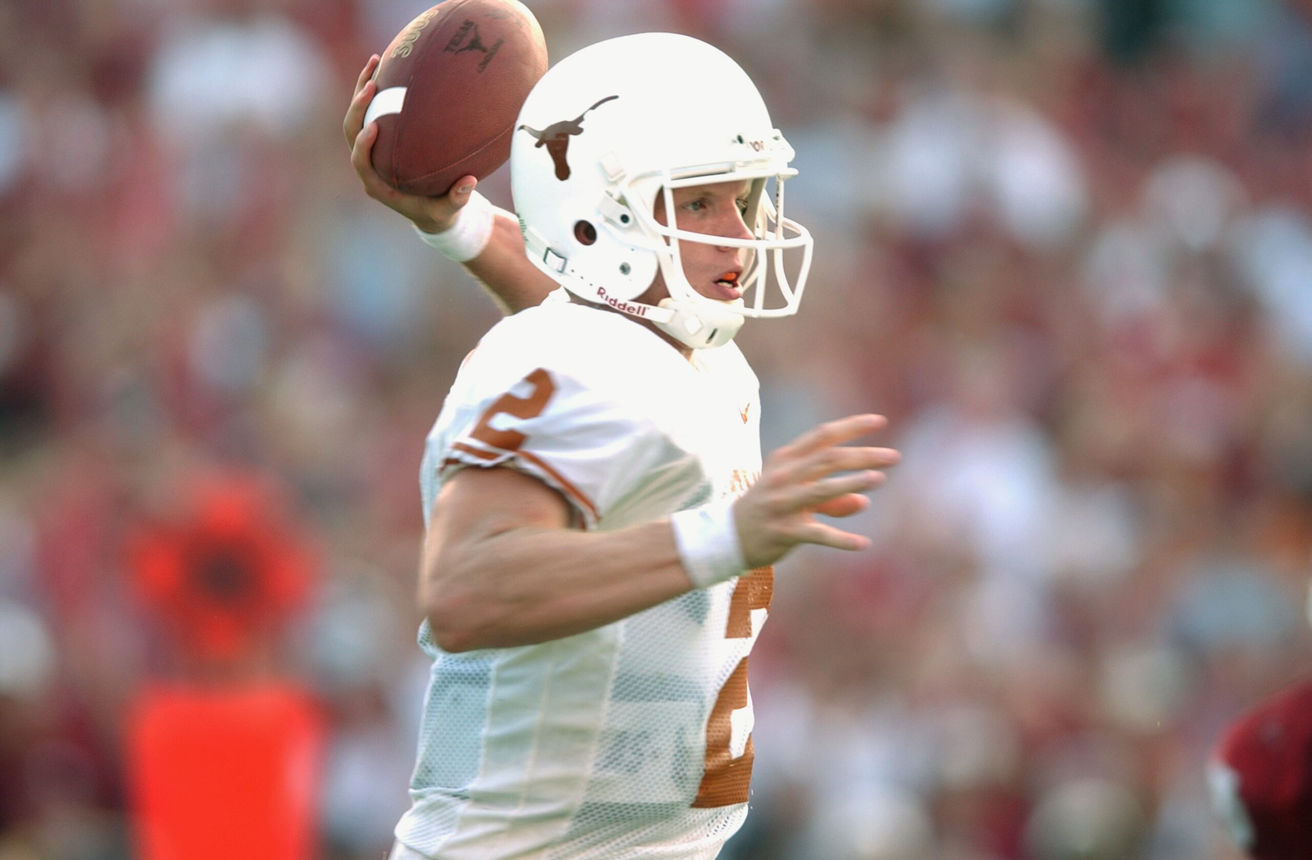 DALLAS - OCTOBER 12:  Quarterback Chris Simms #2 of the Texas Longhorns passes in the pocket against the Oklahoma Sooners on October 12, 2002 at the Cotton Bowl in Dallas, Texas.  Oklahoma defeated Texas 35-24.  (Photo by Harry How/Getty Images)