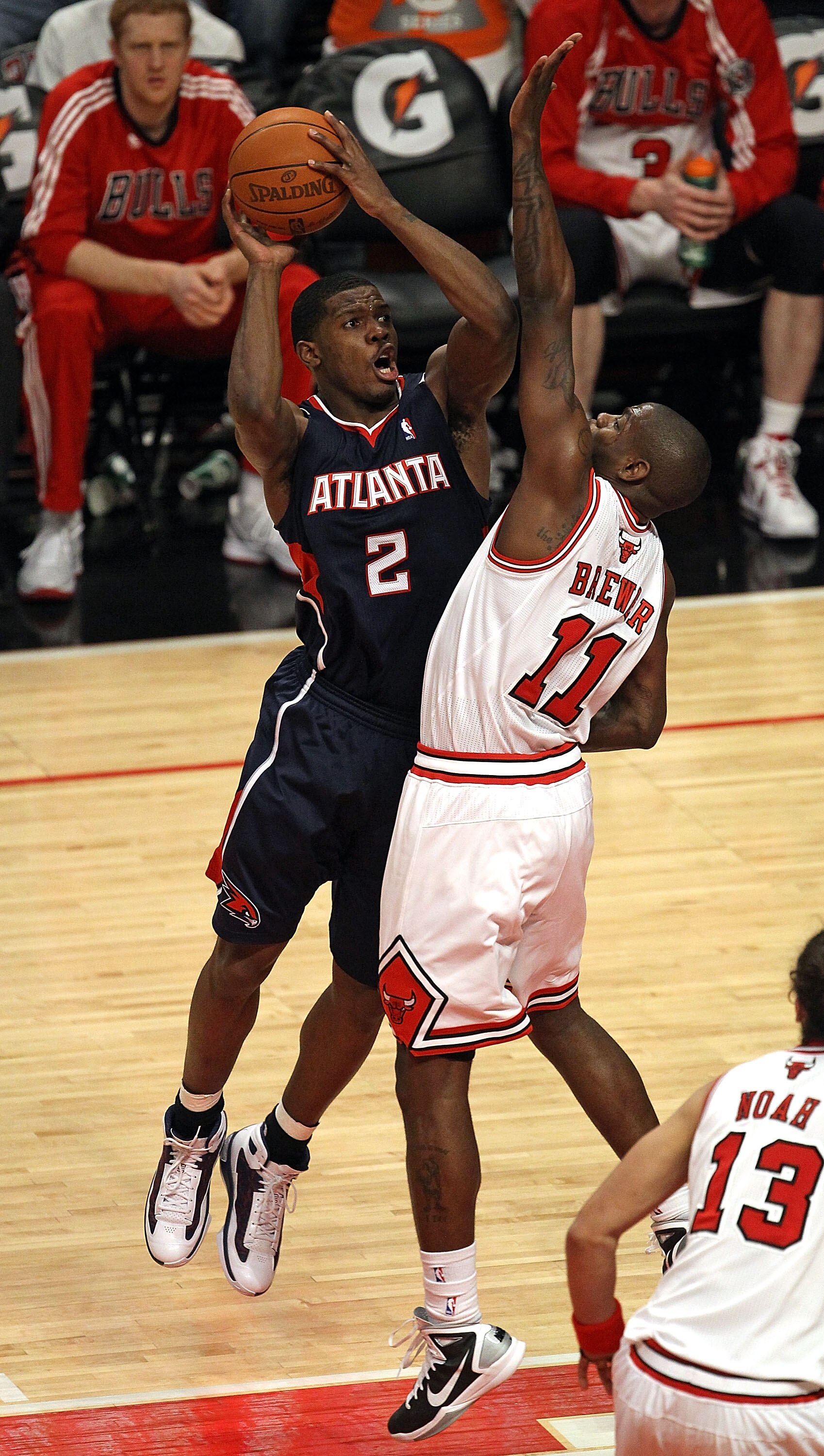 CHICAGO, IL - MARCH 11: Joe Johnson #2 of the Atlanta Hawks puts up a shot under pressure from Ronnie Brewer #11 of the Chicago Bulls at the United Center on March 11, 2011 in Chicago, Illinois. The Bulls defeated the Hawks 94-76. NOTE TO USER: User expre