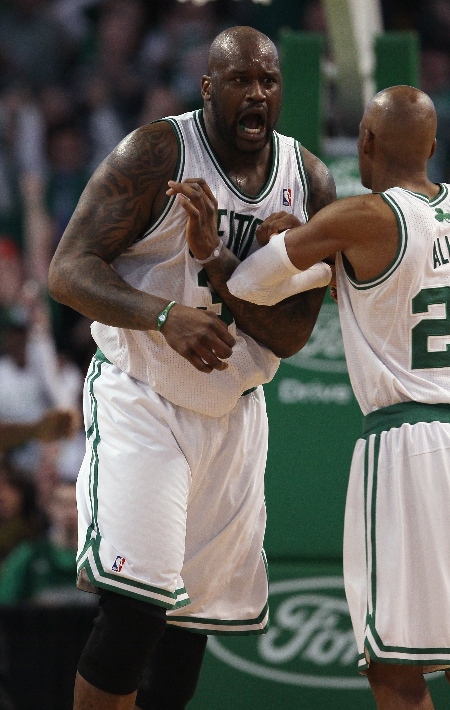 BOSTON, MA - JANUARY 19:  Shaquille O'Neal #36 of the Boston Celtics celebrates with teammate Ray Allen #20 in the fourth quarter against the Detroit Pistons on January 19, 2011 at the TD Garden in Boston, Massachusetts. The Celtics defeated the Pistons 8