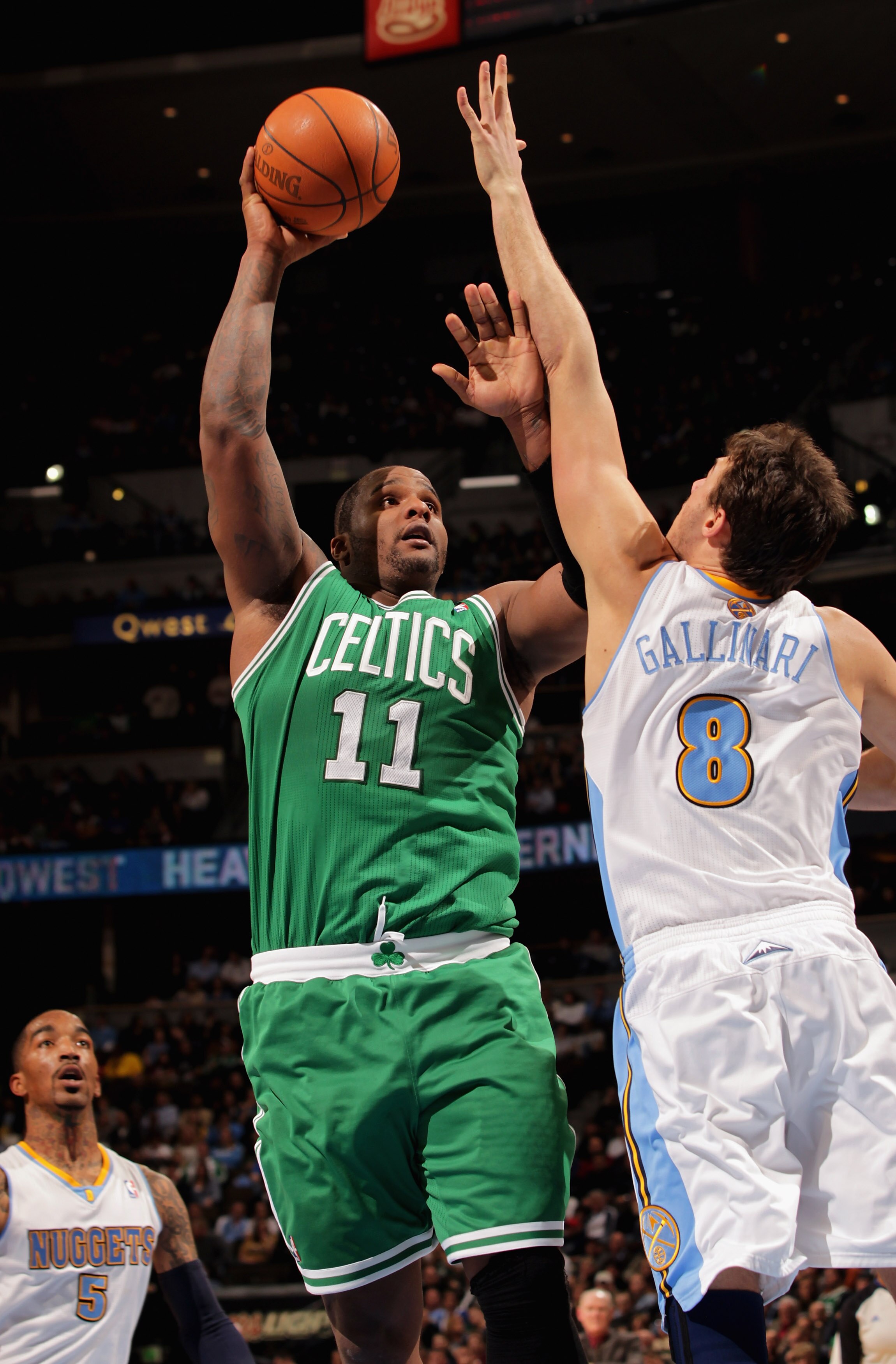 DENVER, CO - FEBRUARY 24:  Glen Davis #11 of the Boston Celtics takes a shot against Danilo Gallinari #8 of the Denver Nuggets during NBA action at the Pepsi Center on February 24, 2011 in Denver, Colorado. NOTE TO USER: User expressly acknowledges and ag
