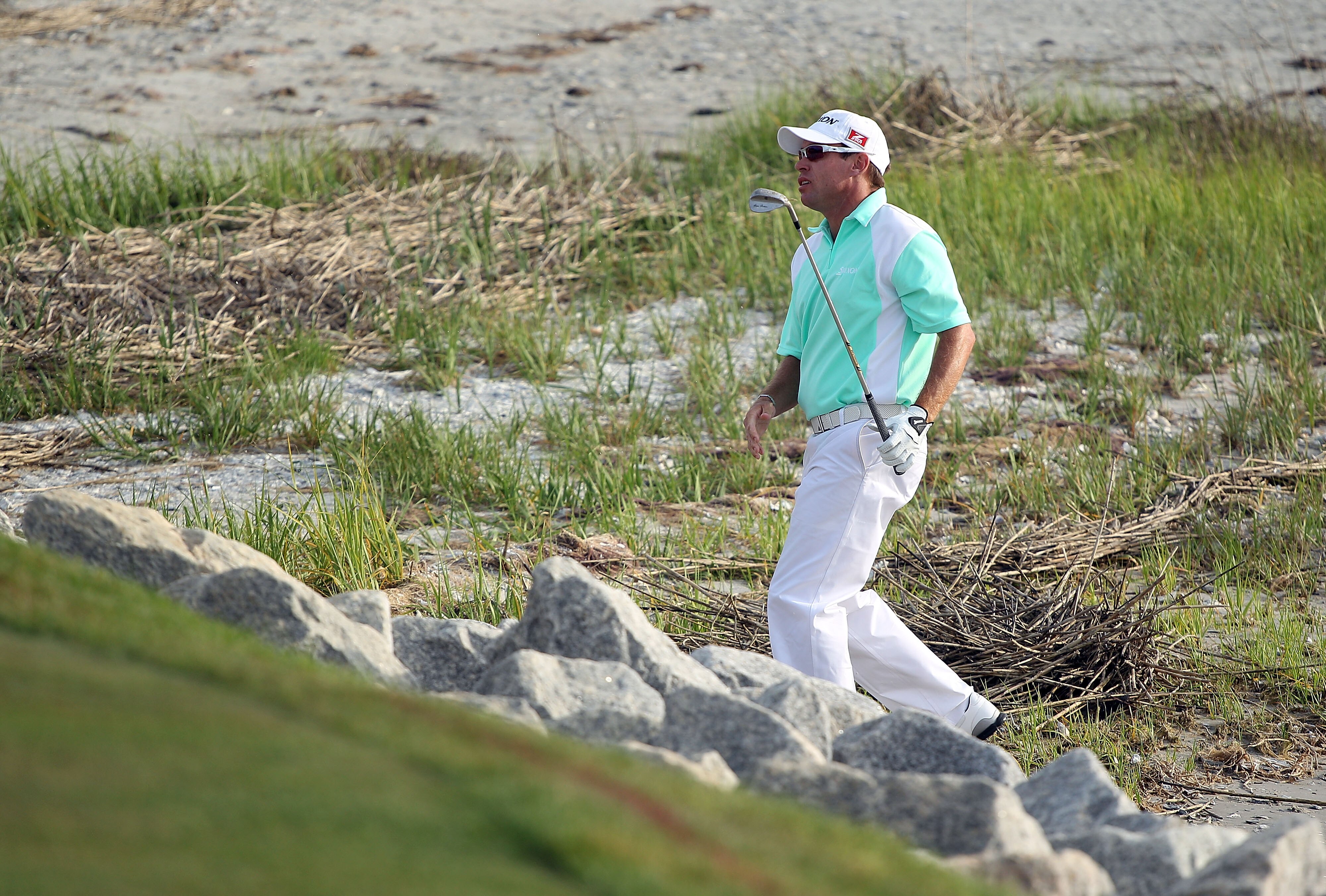 HILTON HEAD ISLAND, SC - APRIL 18:  Brian Davis of England plays a shot from the beach on the first playoff hole during the final round of the Verizon Heritage at the Harbour Town Golf Links on April 18, 2010 in Hilton Head lsland, South Carolina.  (Photo