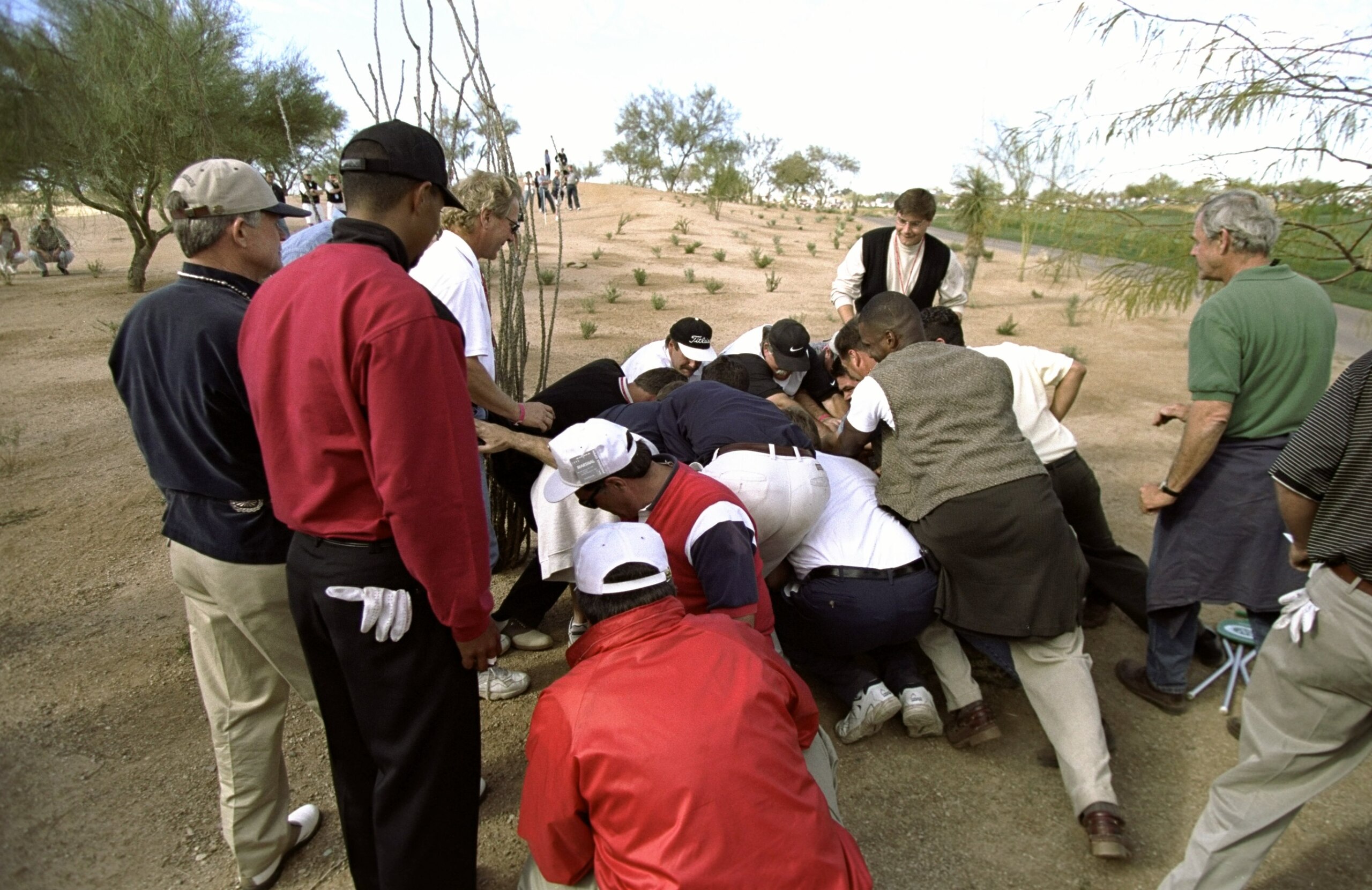 31 Jan 1999: Tiger Woods watches as fans move the boulder out of the way during the Phoenix Open at the TPC of Scottsdale in Scottsdale, Arizona.