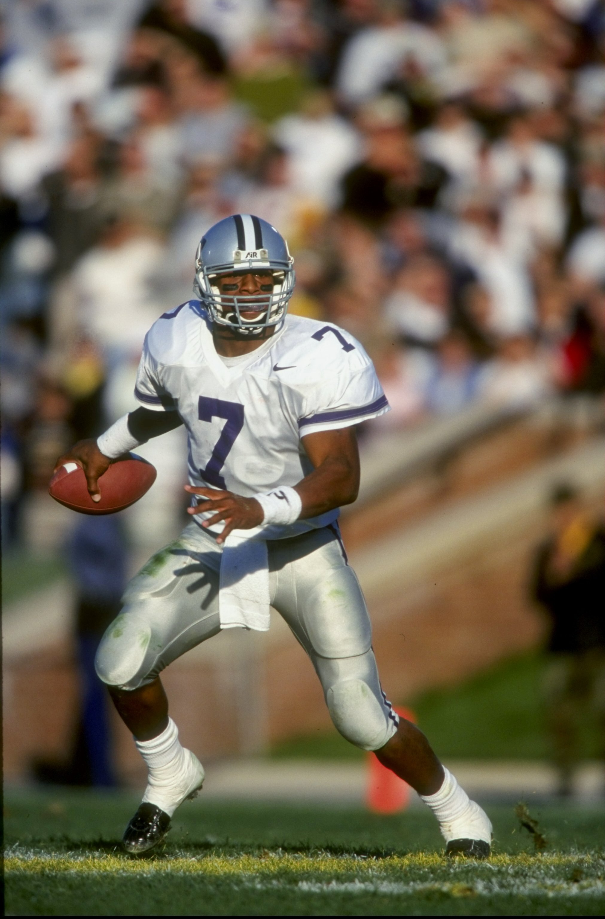 21 Nov 1998: Quarterback Michael Bishop #7 of the Kansas State Wildcats grips the ball as he runs during the game against the Missouri Tigers at Faurot Fiald in Columbus, Missouri. Kansas State defeated Missouri 31-25. Mandatory Credit: Brian Bahr  /Allsp
