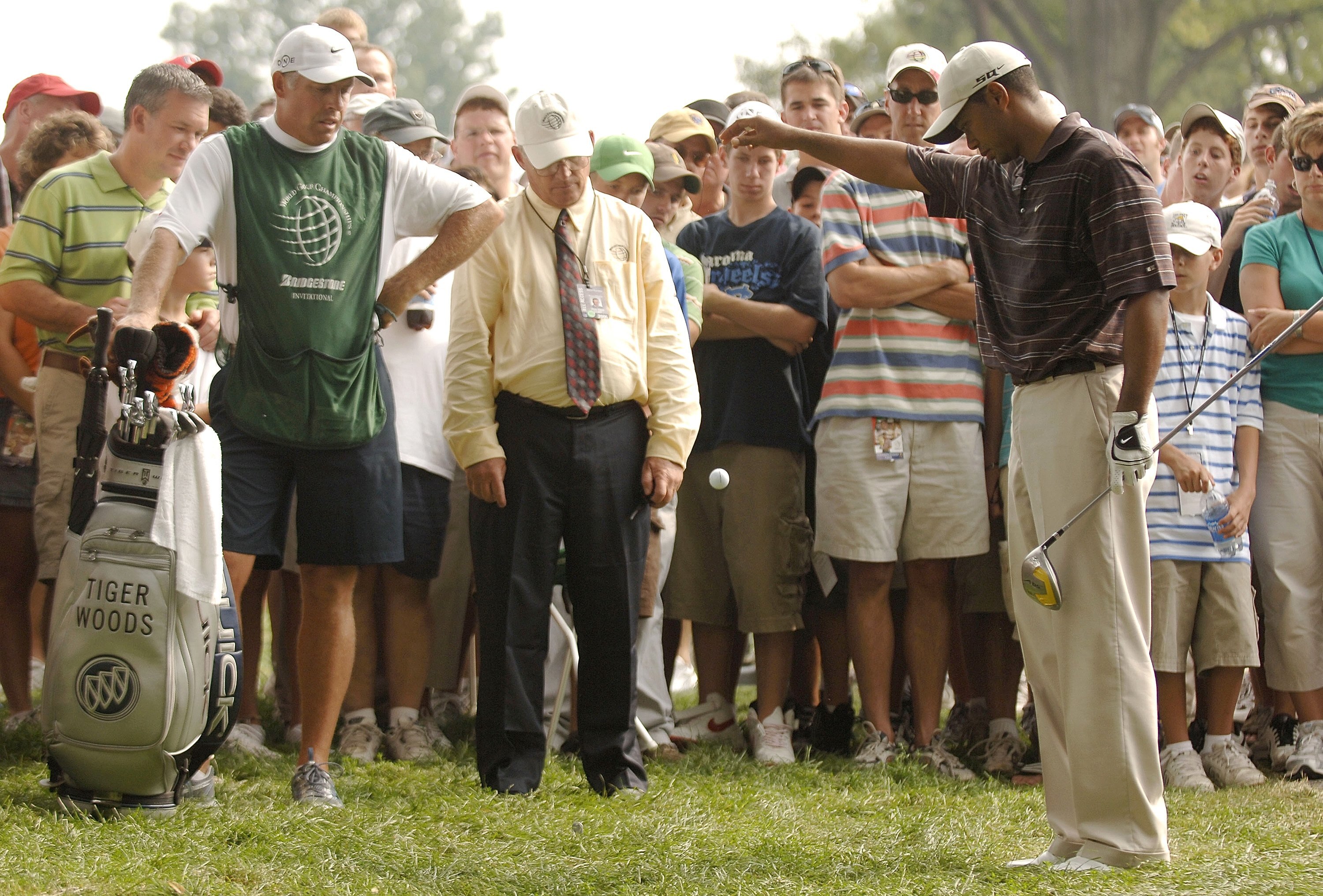 AKRON, OHIO - AUGUST 26:  Tiger Woods makes a drop after his tee shot on the ninth during the Bridgestone Invitational at Firestone C.C. August 26, 2006 in Akron, Ohio.  (Photo by Montana Pritchard/Getty Images)