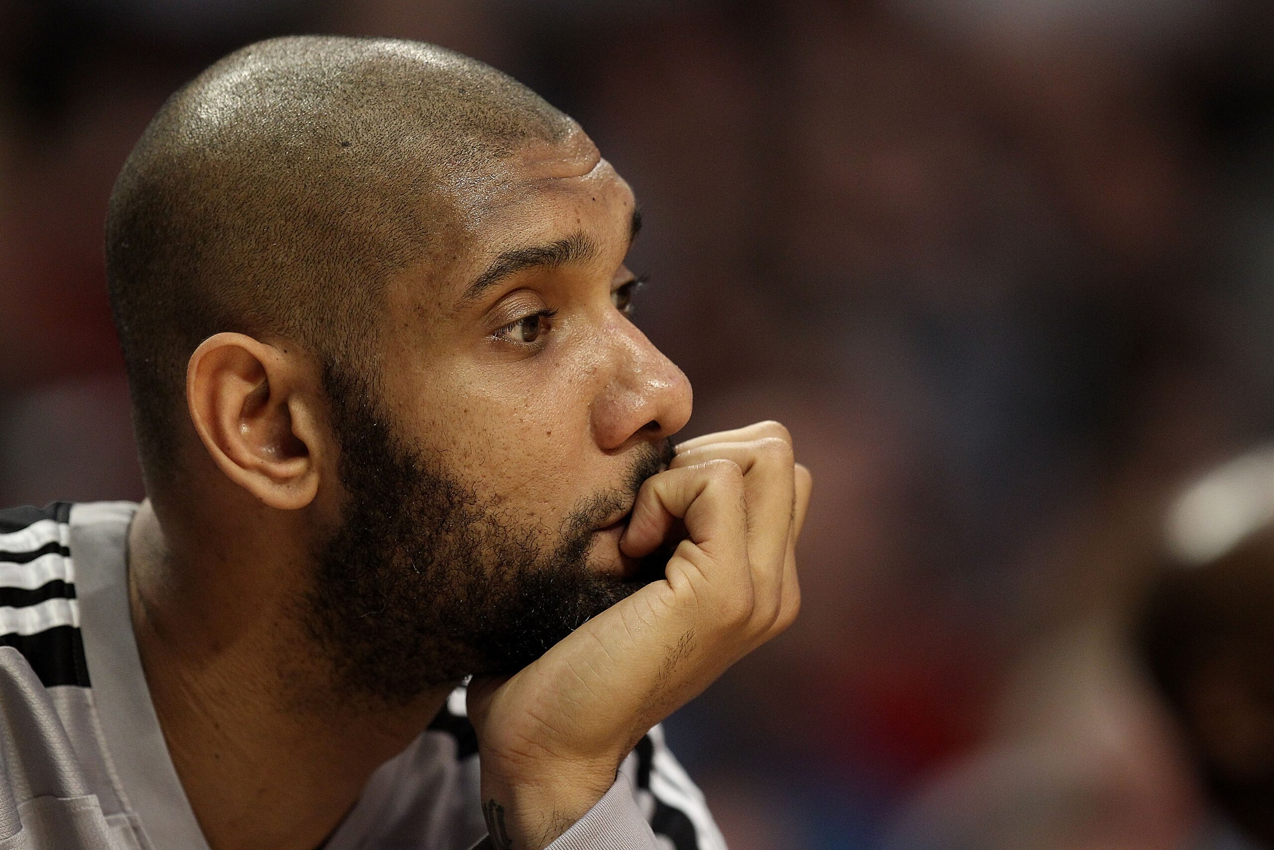 CHICAGO, IL - FEBRUARY 17: Tim Duncan #21 of the San Antonio Spurs watches from the bench as his teammates take on the Chicago Bulls at the United Center on February 17, 2011 in Chicago, Illinois. The Bulls defeated the Spurs 109-99. NOTE TO USER: User ex
