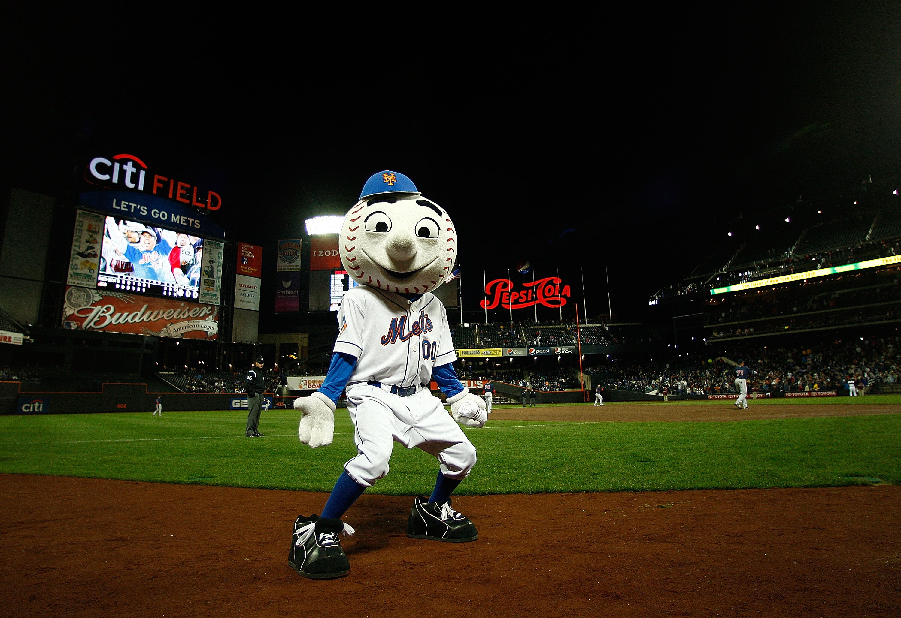 NEW YORK - APRIL 03:  Mr Met  gets the crowd going during an exhibition game between the New York Mets and the Boston Red Sox on April 3, 2009 at Citi Field in the Flushing neighborhood of the Queens borough of New York City. The game marks the first time