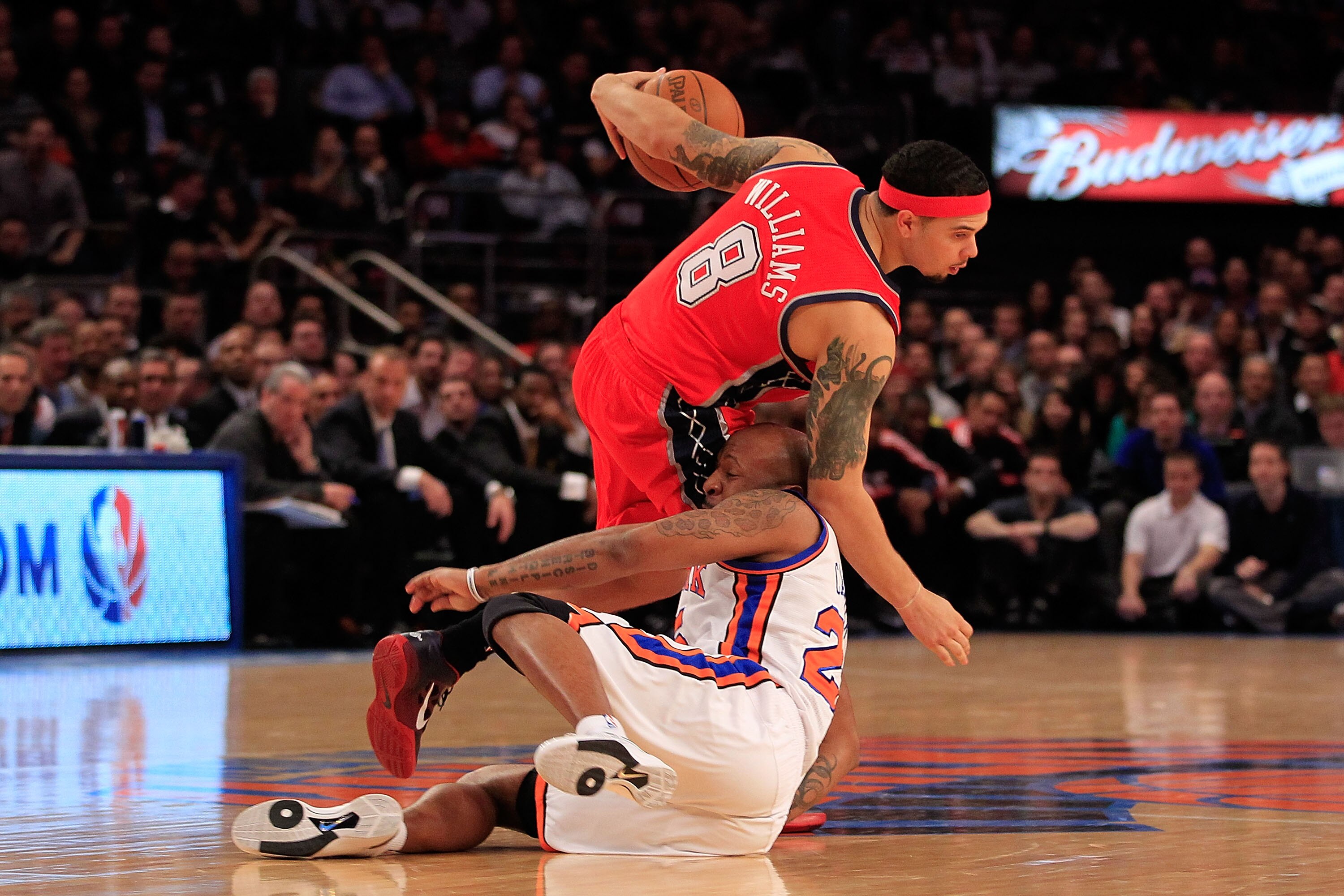 NEW YORK, NY - MARCH 30:  Deron Williams #8 of the New Jersey Nets drives against Anthony Carter#25 of the New York Knicks at Madison Square Garden on March 30, 2011 in New York City. NOTE TO USER: User expressly acknowledges and agrees that, by downloadi