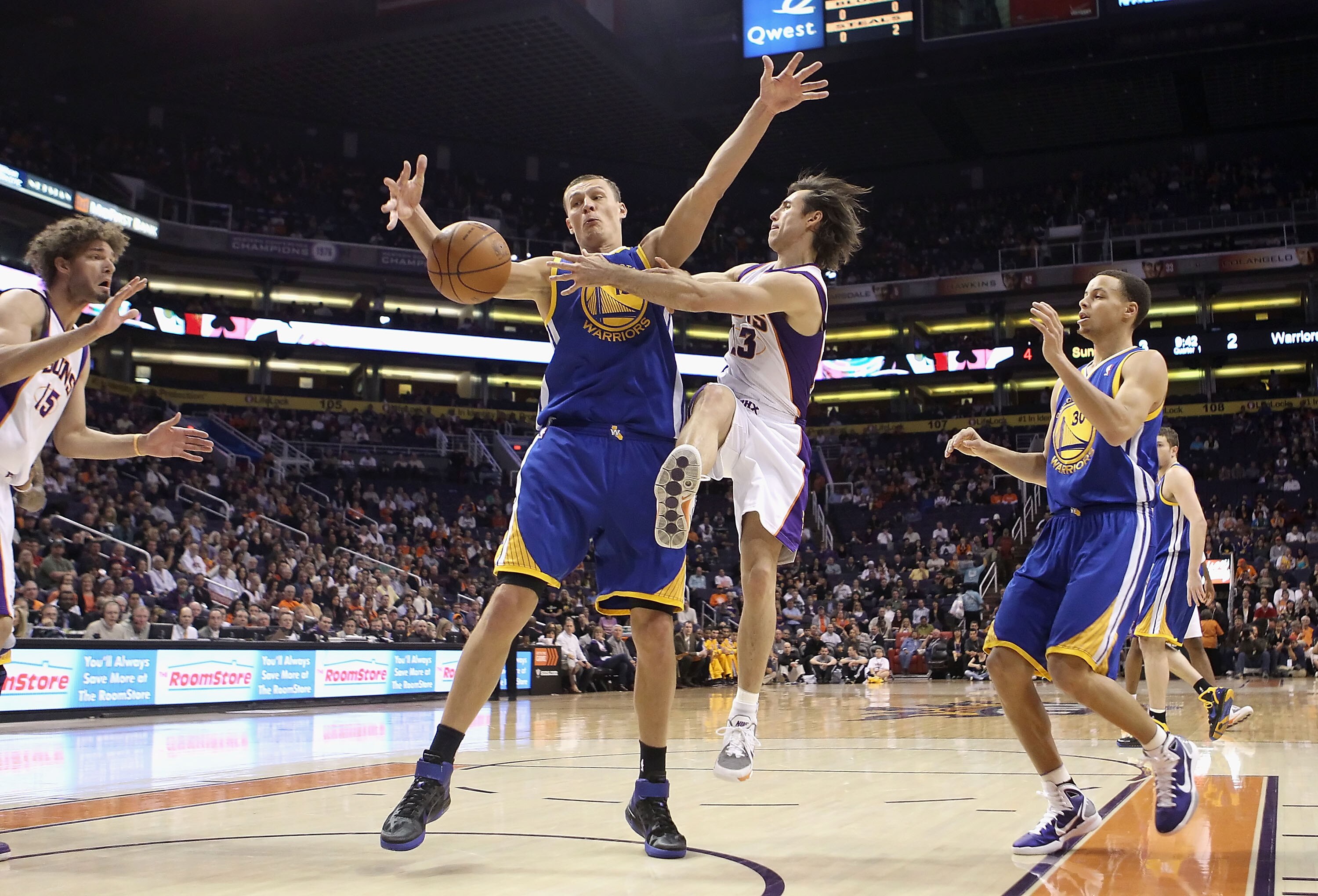 PHOENIX, AZ - FEBRUARY 10:  Steve Nash #13 of the Phoenix Suns passes the ball during the NBA game against the Golden State Warriors at US Airways Center on February 10, 2011 in Phoenix, Arizona.  The Suns defeated the Warriors 112-88.  NOTE TO USER: User