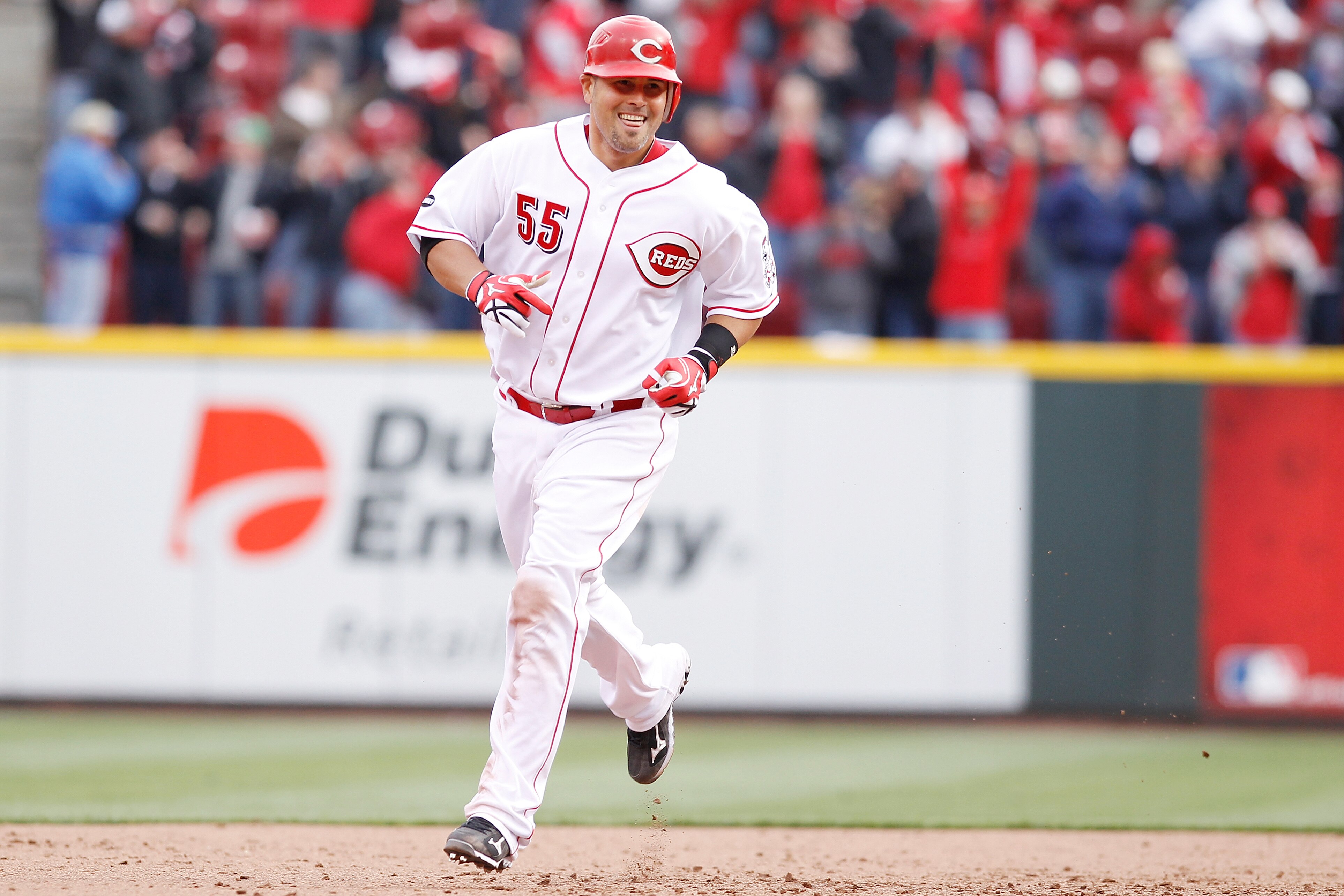 CINCINNATI, OH - MARCH 31: Ramon Hernandez #55 of the Cincinnati Reds rounds the bases after hitting the game-winning home run in the ninth inning against the Milwaukee Brewers in the opening day game at Great American Ballpark on March 31, 2011 in Cincin