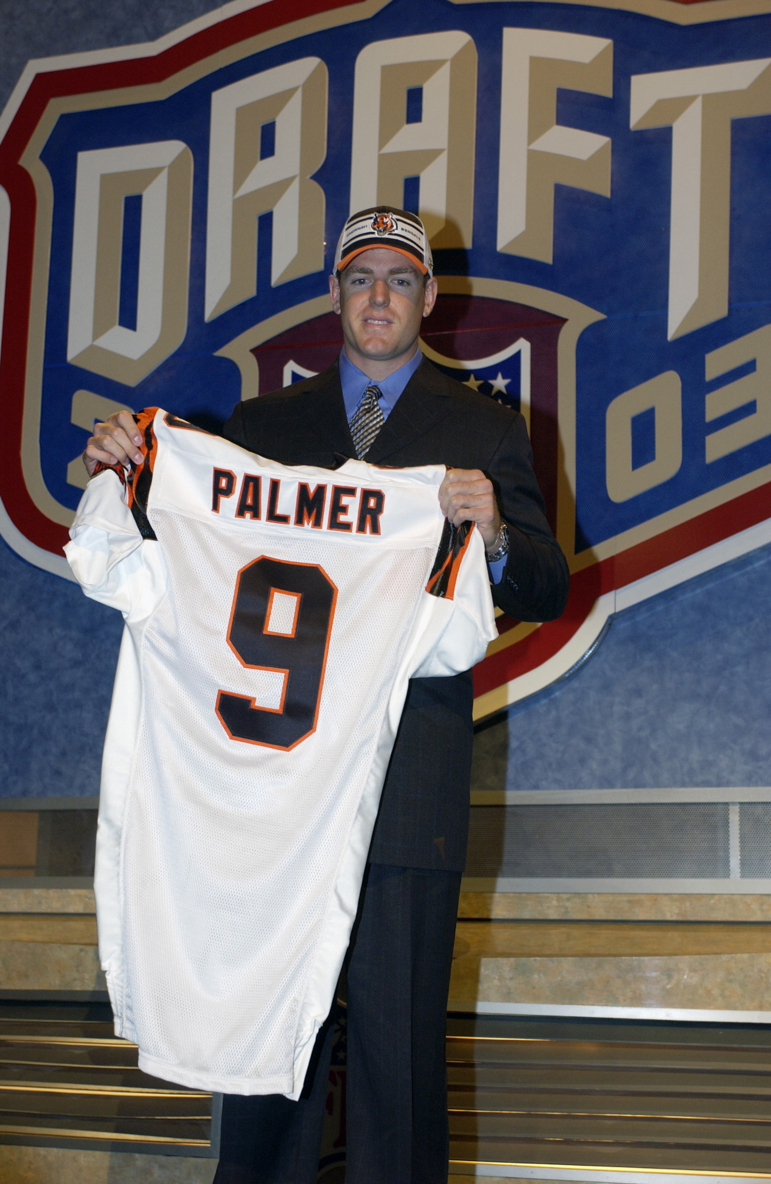 NEW YORK CITY - APRIL 26: Carson Palmer from USC after being selected first by the Cincinnati Bengals at the 2003 NFL Draft on April 26, 2003 at Madison Square Garden in New York City. Palmer agreed to a $40 million/seven year deal on April 24 that inclu NEW YORK CITY - APRIL 26: Carson Palmer from USC after being selected first by the Cincinnati Bengals at the 2003 NFL Draft on April 26, 2003 at Madison Square Garden in New York City. Palmer agreed to a $40 million/seven year deal on April 24 that inclu