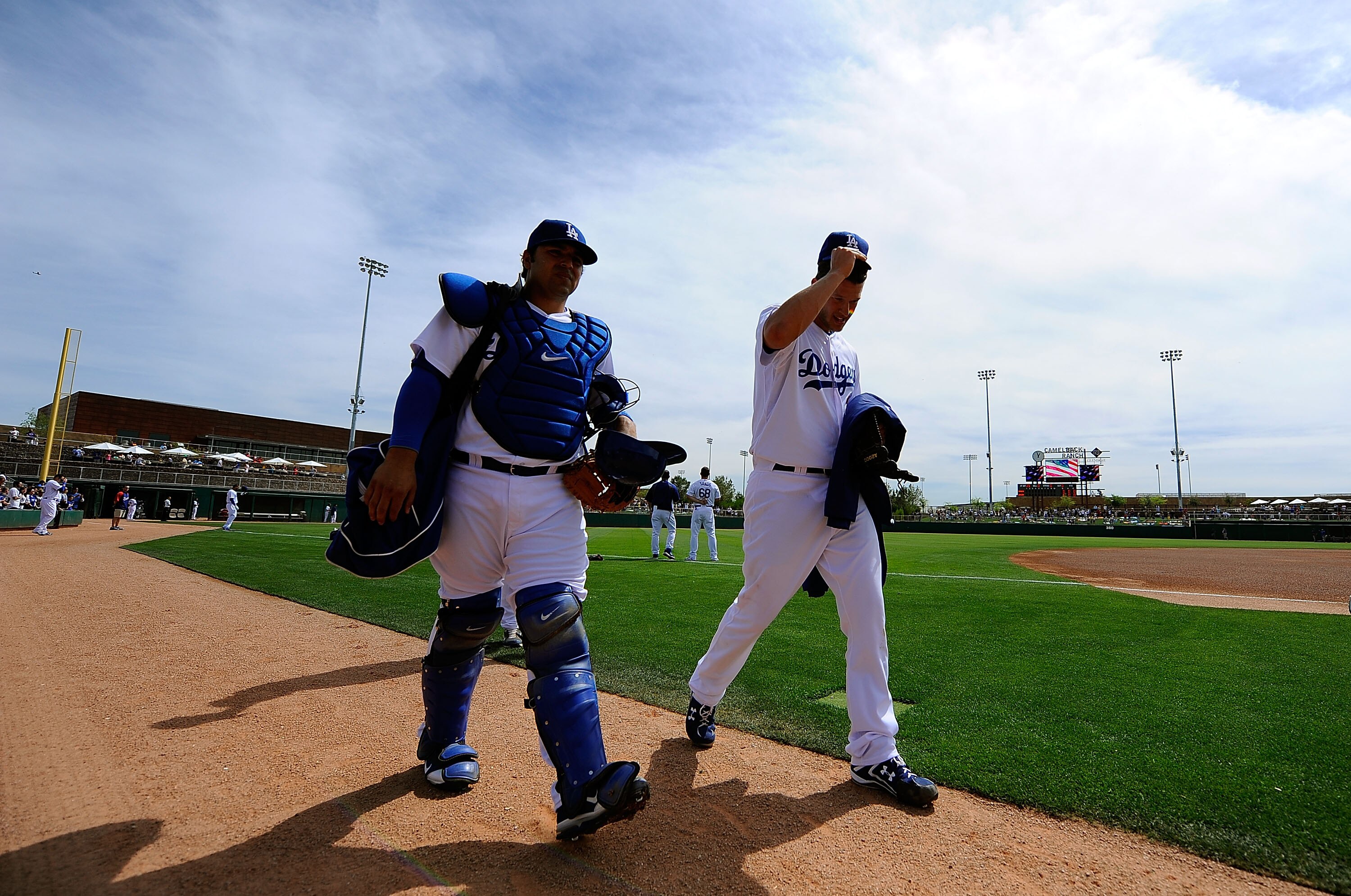 GLENDALE, AZ - MARCH 15:  Catcher Rod Barajas #28 and pitcher Clayton Kershaw #22 of the Los Angeles Dodgers walk on the field before playing against the Texas Rangers in the spring training baseball game at Camelback Ranch on March 15, 2011 in Glendale,