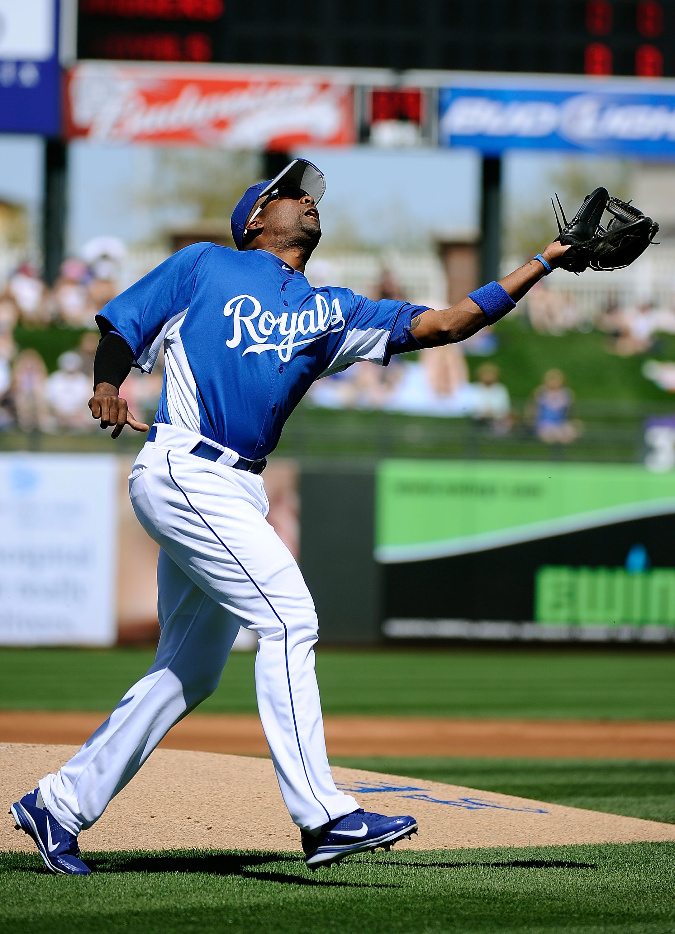 SURPRISE, AZ - MARCH 12:  Wilson Betemit #24 of the Kansas City Royals drops the ball during the spring training baseball game at Surprise Stadium against the Los Angeles Dodgers on March 12, 2011 in Surprise, Arizona.  (Photo by Kevork Djansezian/Getty I
