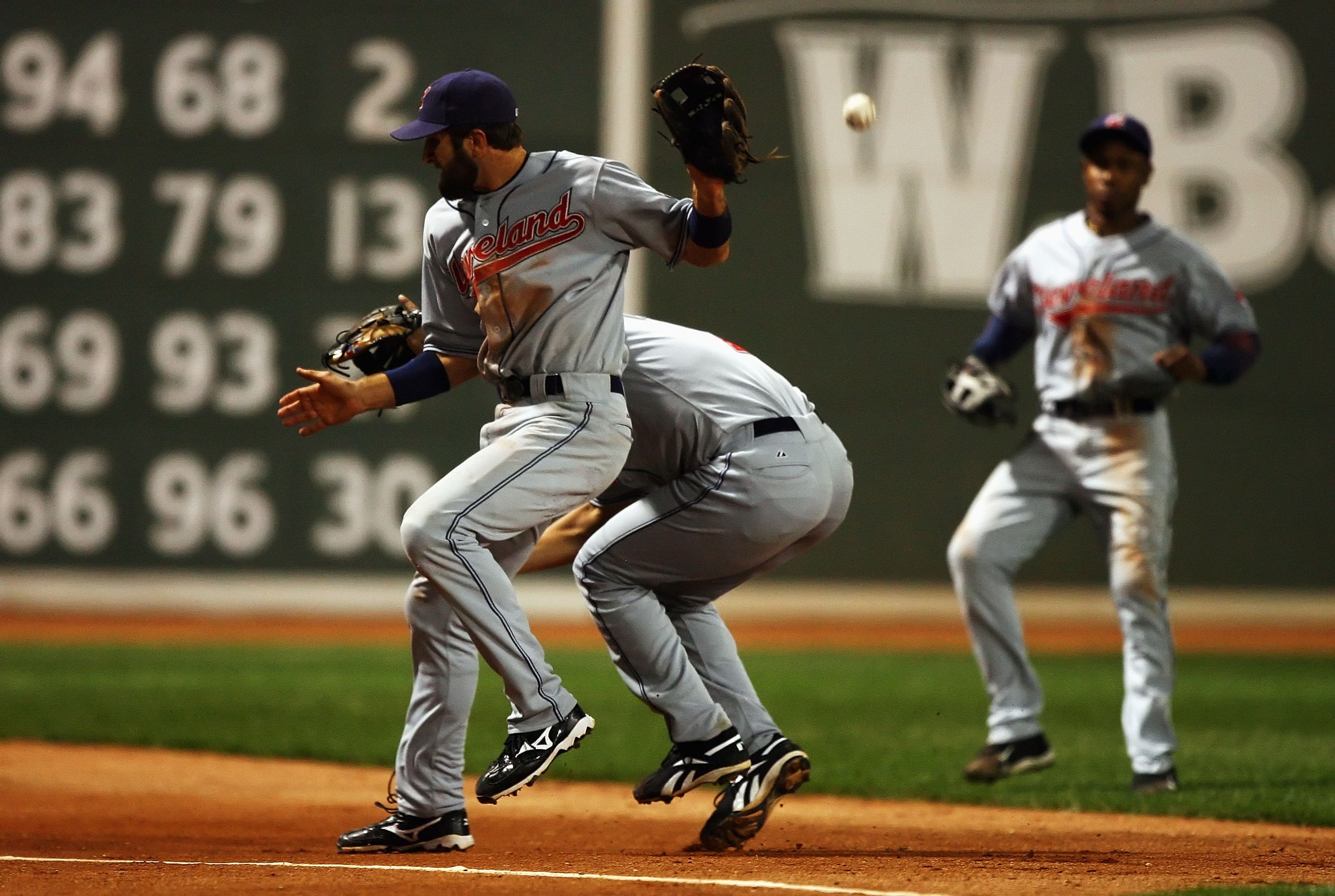 BOSTON - OCTOBER 21:  Casey Blake #1 and Jhonny Peralta #2 of the Cleveland Indians collide while attempting to field a pop fly in foul territory against the Boston Red Sox during Game Seven of the American League Championship Series at Fenway Park on Oct