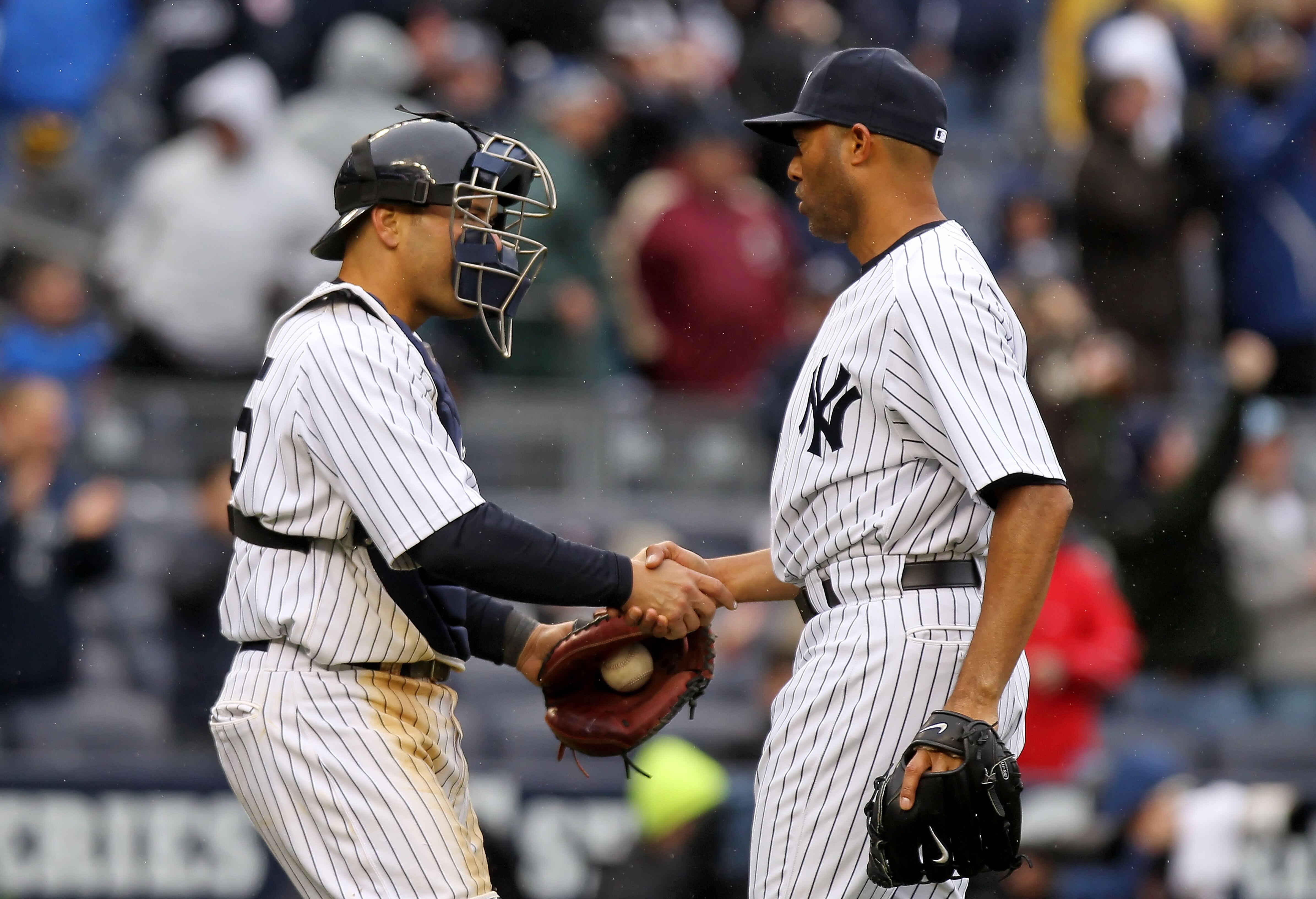 NEW YORK, NY - MARCH 31:  Russell Martin #55 and Mariano Rivera #42 of the New York Yankees celebrate their 6-3 win over the Detroit Tigers on Opening Day at Yankee Stadium on March 31, 2011 in the Bronx borough of New York City.  (Photo by Nick Laham/Get