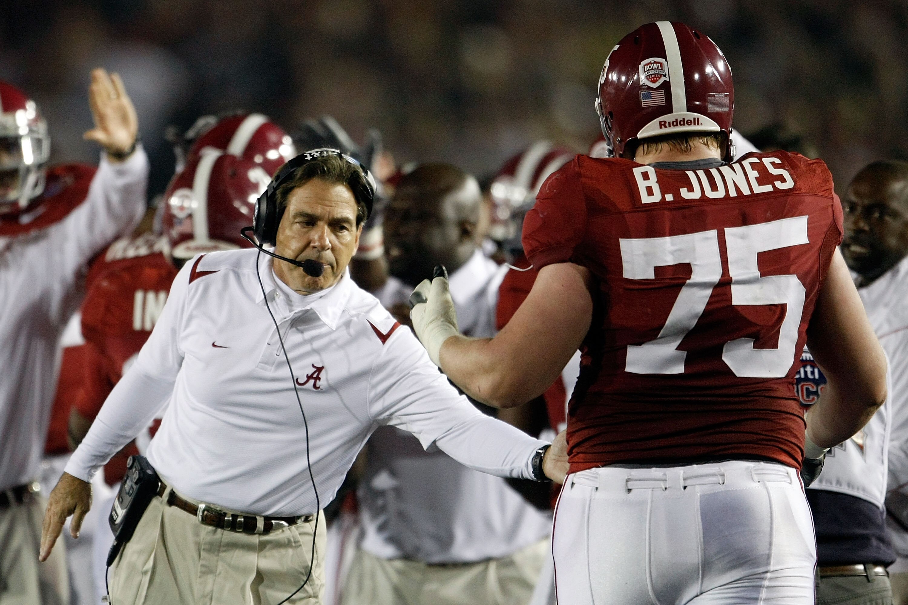 PASADENA, CA - JANUARY 07:  Head coach Nick Saban of the Alabama Crimson Tide congratulates lineman Barrett Jones #75 after a touchdown against the Texas Longhorns in the second quarter of the Citi BCS National Championship game at the Rose Bowl on Januar