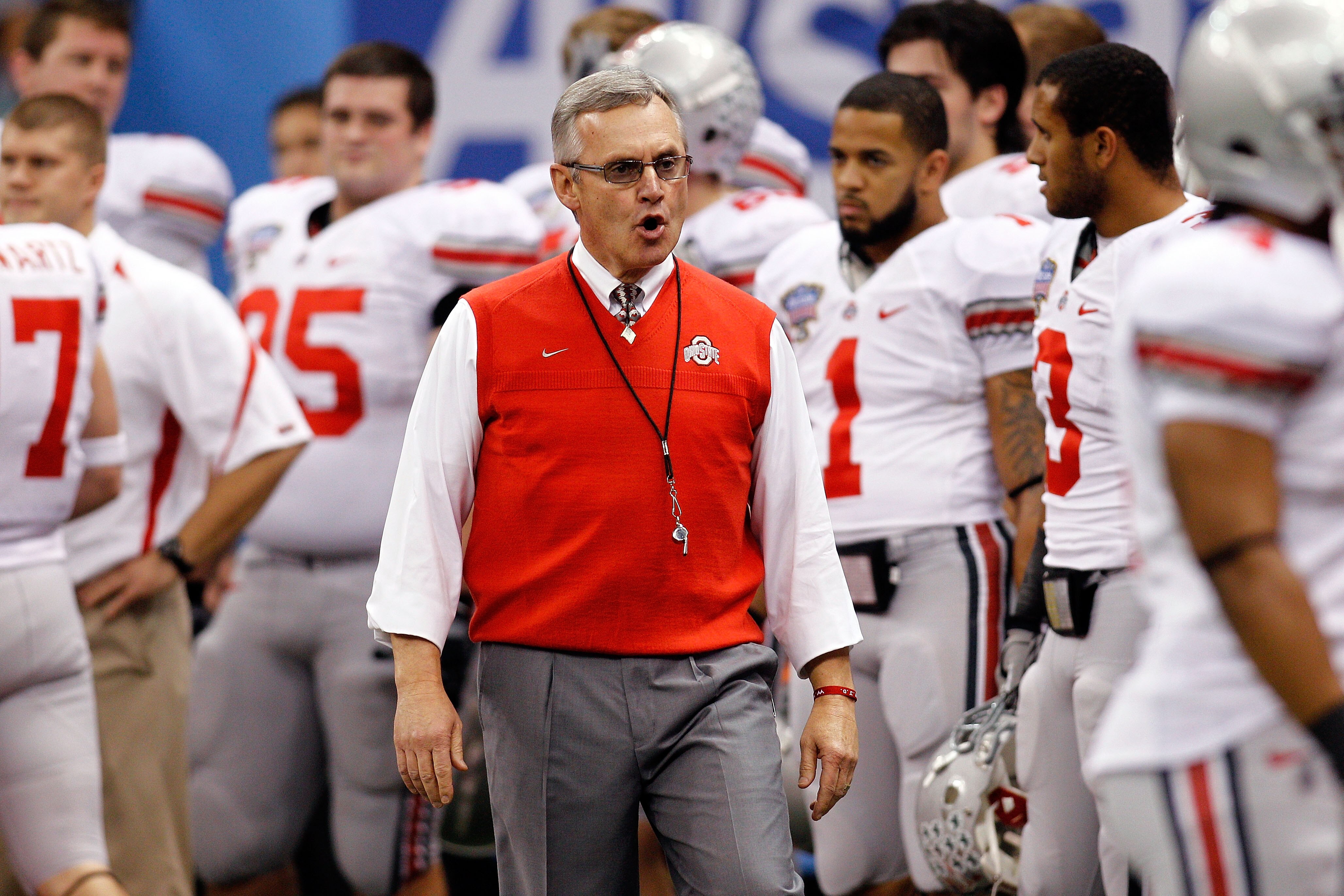 NEW ORLEANS, LA - JANUARY 04:  Head coach Jim Tressel of the Ohio State Buckeyes gathers his team before the Allstate Sugar Bowl against the Arkansas Razorbacks at the Louisiana Superdome on January 4, 2011 in New Orleans, Louisiana.  (Photo by Chris Gray
