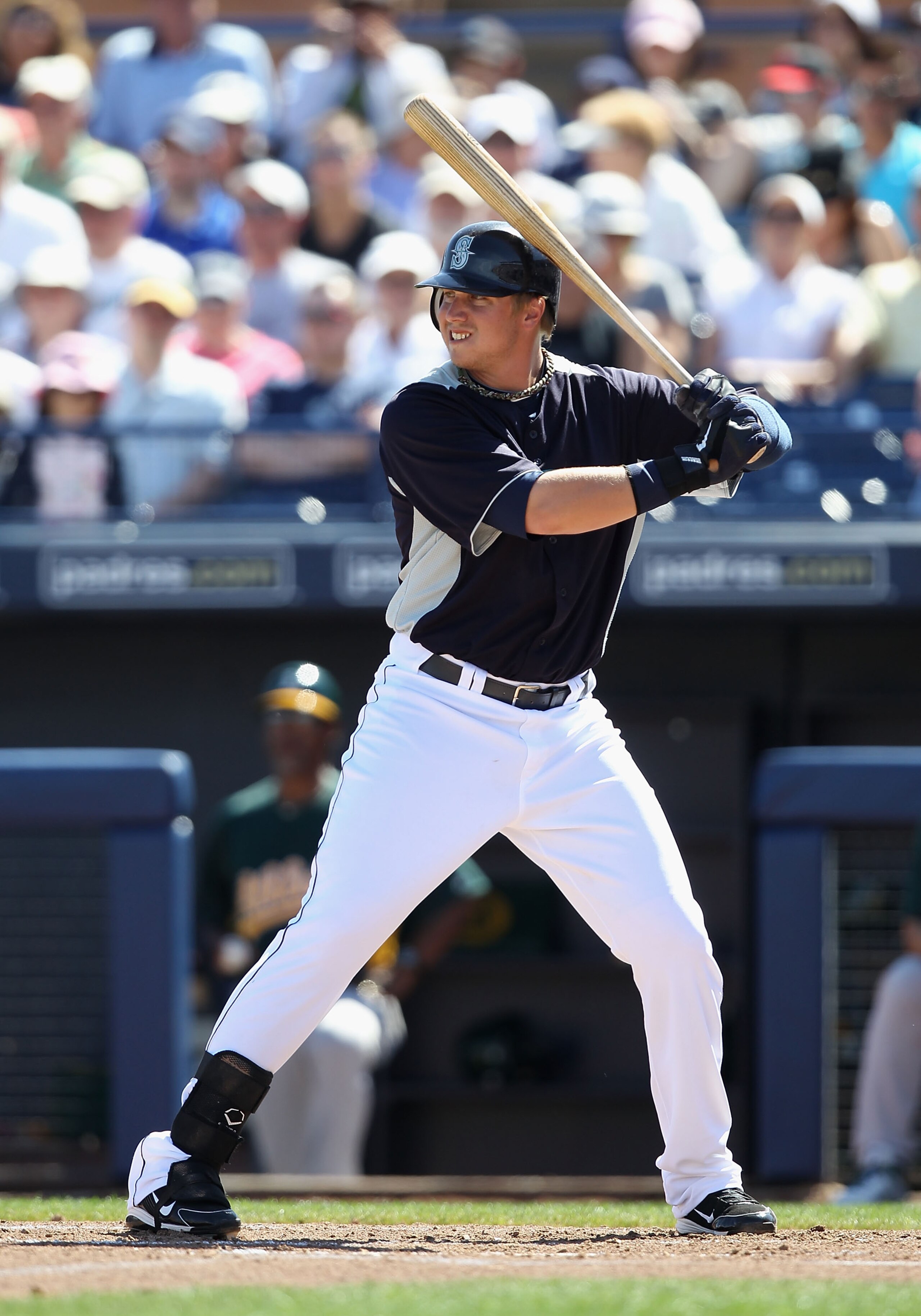 PEORIA, AZ - MARCH 12:  Justin Smoak #17 of the Seattle Mariners bats against the Oakland Athletics during the spring training game at Peoria Stadium on March 12, 2011 in Peoria, Arizona.  (Photo by Christian Petersen/Getty Images)