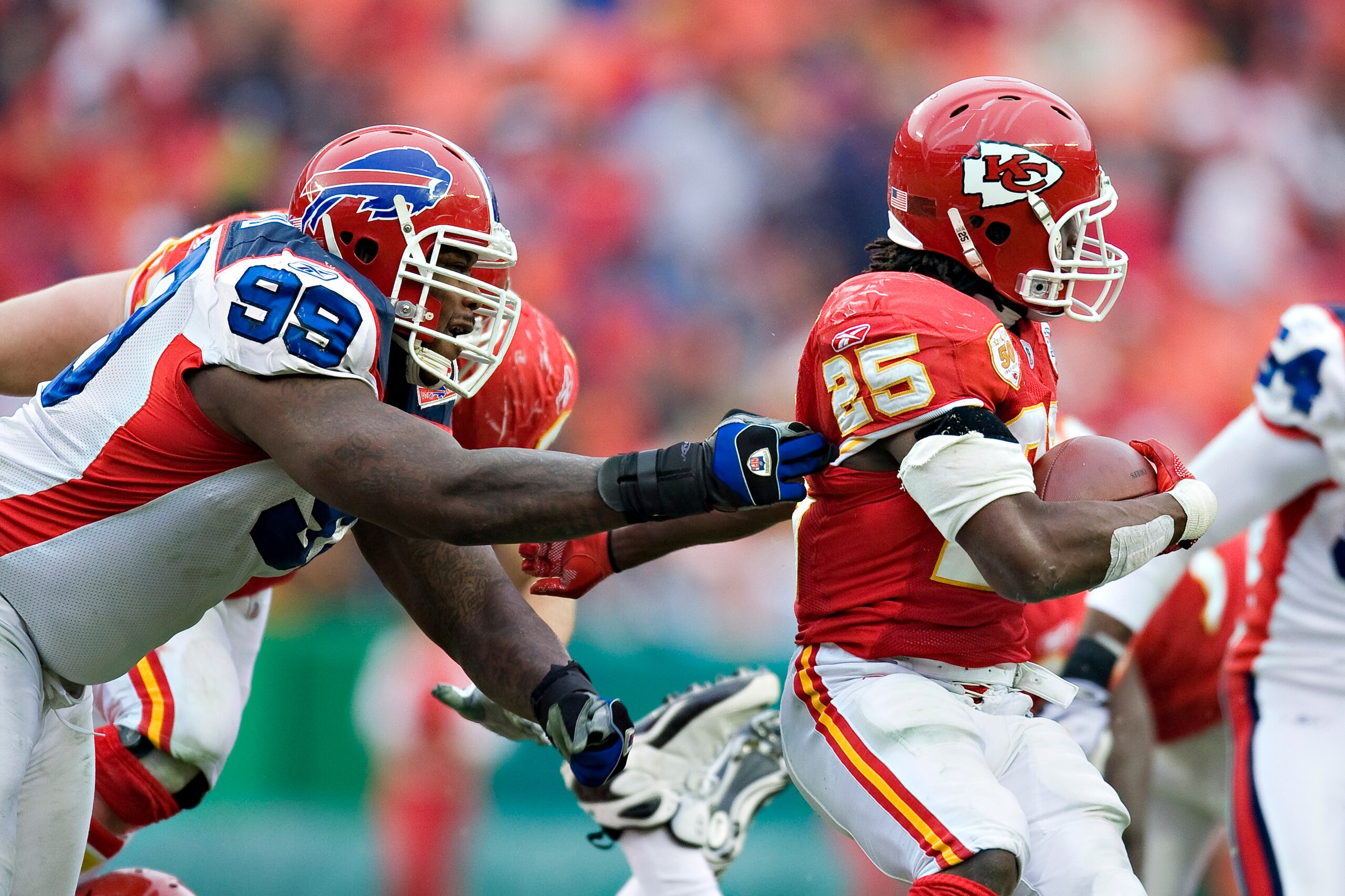 KANSAS CITY, MO - DECEMBER 13: Defensive tackle Marcus Stroud #99 of the Buffalo Bills grabs the jersey of running back Jamaal Charles #25 of the Kansas City Chiefs at Arrowhead Stadium on December 13, 2009 Kansas City, Missouri. The Bills defeated the C KANSAS CITY, MO - DECEMBER 13: Defensive tackle Marcus Stroud #99 of the Buffalo Bills grabs the jersey of running back Jamaal Charles #25 of the Kansas City Chiefs at Arrowhead Stadium on December 13, 2009 Kansas City, Missouri. The Bills defeated the C