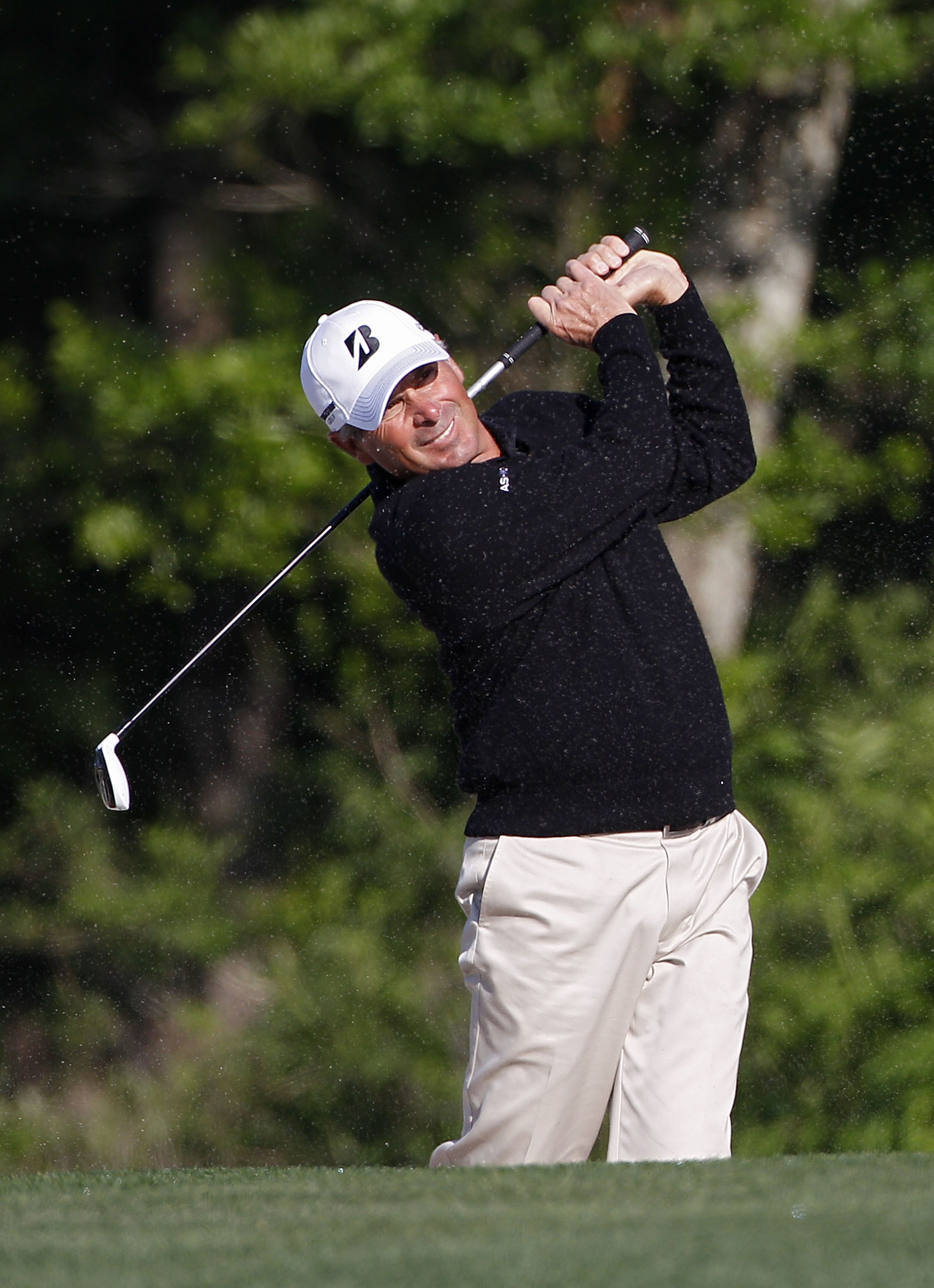 HUMBLE, TX - MARCH 31:  Fred Couples hits a shot from a fairway bunker during the first round of the Shell Houston Open at Redstone Golf Club on March 31, 2011 in Humble, Texas.  (Photo by Michael Cohen/Getty Images)