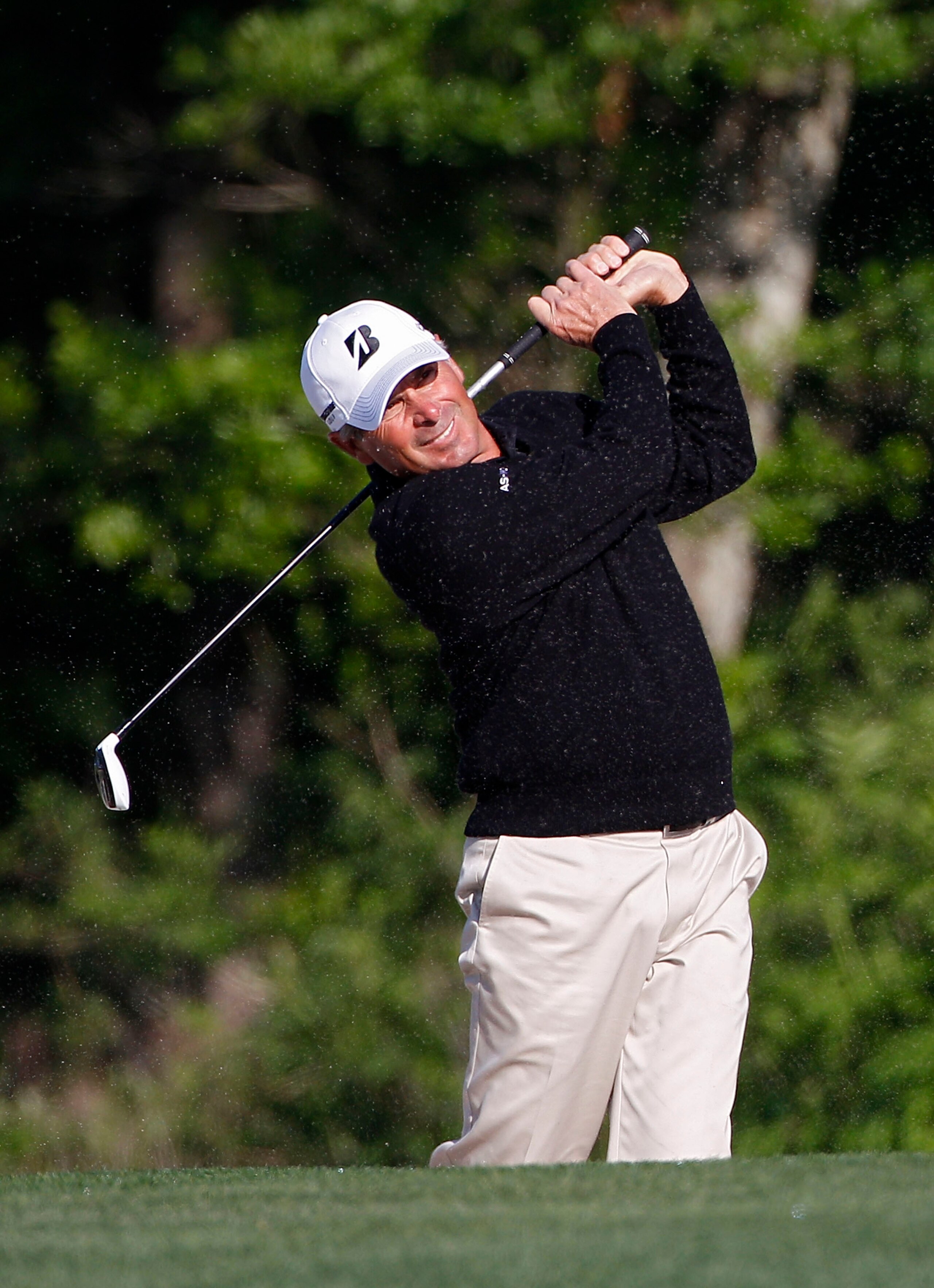 HUMBLE, TX - MARCH 31:  Fred Couples hits a shot from a fairway bunker during the first round of the Shell Houston Open at Redstone Golf Club on March 31, 2011 in Humble, Texas.  (Photo by Michael Cohen/Getty Images)