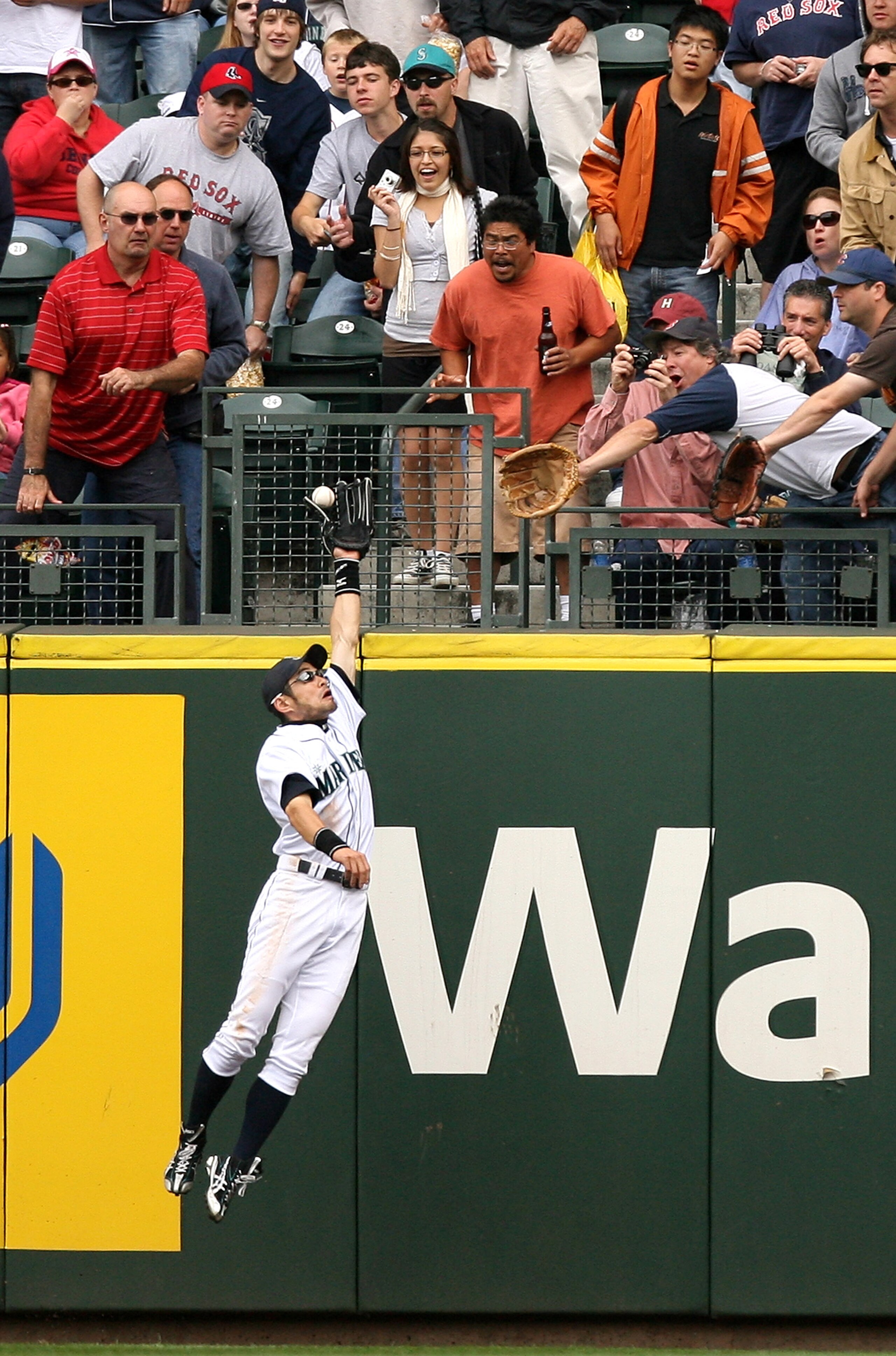 SEATTLE - JULY 23:  Ichiro Suzuki #51 of the Seattle Mariners makes a leaping catch of a ball hit by Dustin Pedroia of the Boston Red Sox on July 23, 2008 at Safeco Field in Seattle, Washington. (Photo by Otto Greule Jr/Getty Images)