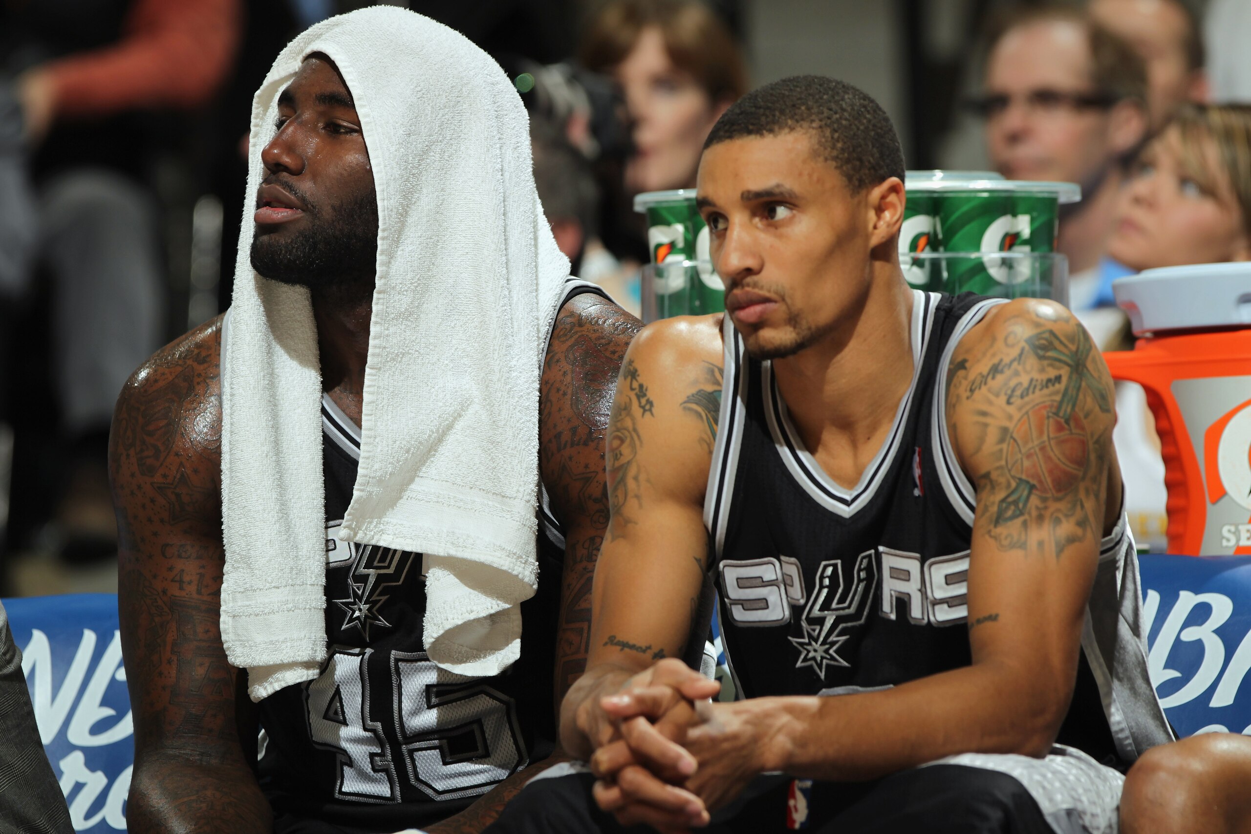 DENVER, CO - MARCH 23:  DeJuan Blair #45 and George Hill #3 of the San Antonio Spurs sit on the bench against the Denver Nuggets at the Pepsi Center on March 23, 2011 in Denver, Colorado. The Nuggets defeated the Spurs 115-112. NOTE TO USER: User expressl
