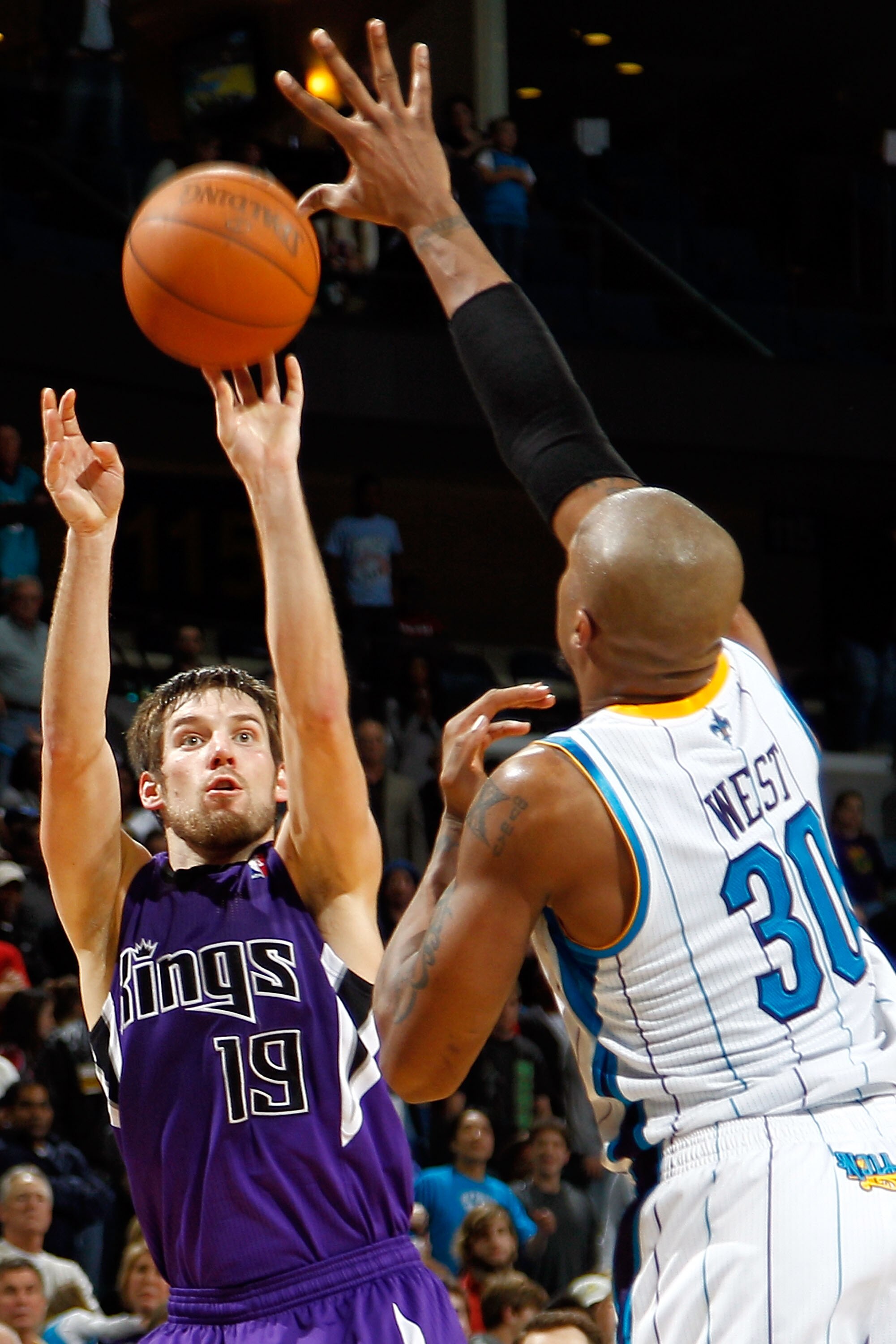 NEW ORLEANS, LA - DECEMBER 15:  Beno Udrih #19 of the Sacramento Kings shoots the ball over David West #30 of the New Orleans Hornets  at the New Orleans Arena on December 15, 2010 in New Orleans, Louisiana.  NOTE TO USER: User expressly acknowledges and