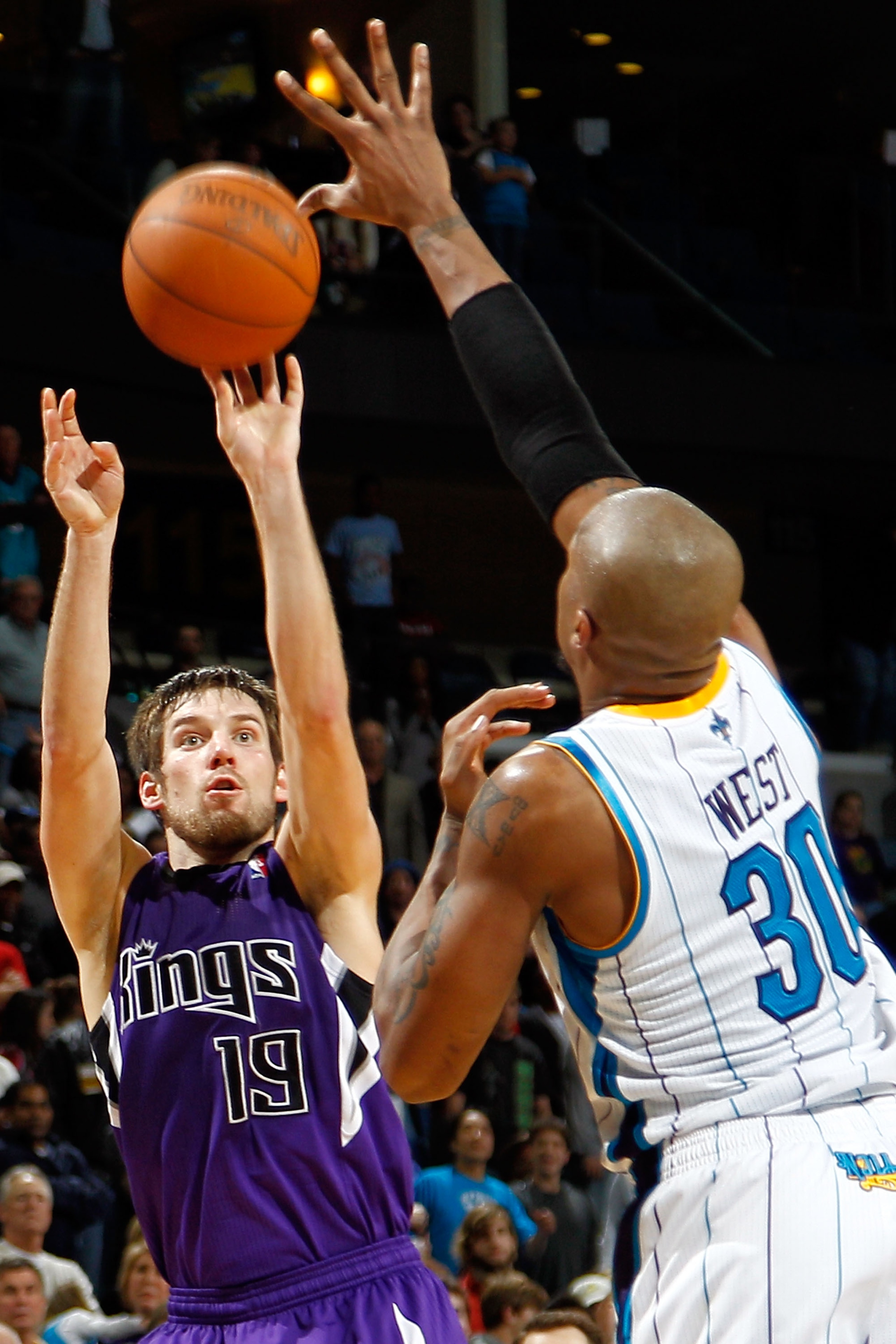 NEW ORLEANS, LA - DECEMBER 15:  Beno Udrih #19 of the Sacramento Kings shoots the ball over David West #30 of the New Orleans Hornets  at the New Orleans Arena on December 15, 2010 in New Orleans, Louisiana.  NOTE TO USER: User expressly acknowledges and