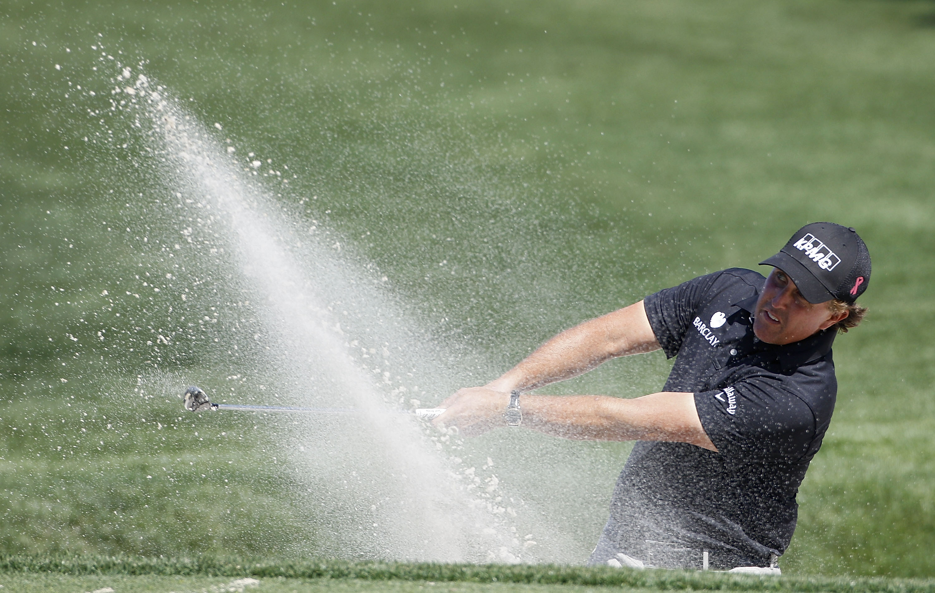 HUMBLE, TX - MARCH 31:  Phil Mickelson hits a shot from a bunker during the first round of the Shell Houston Open at Redstone Golf Club on March 31, 2011 in Humble, Texas.  (Photo by Michael Cohen/Getty Images)