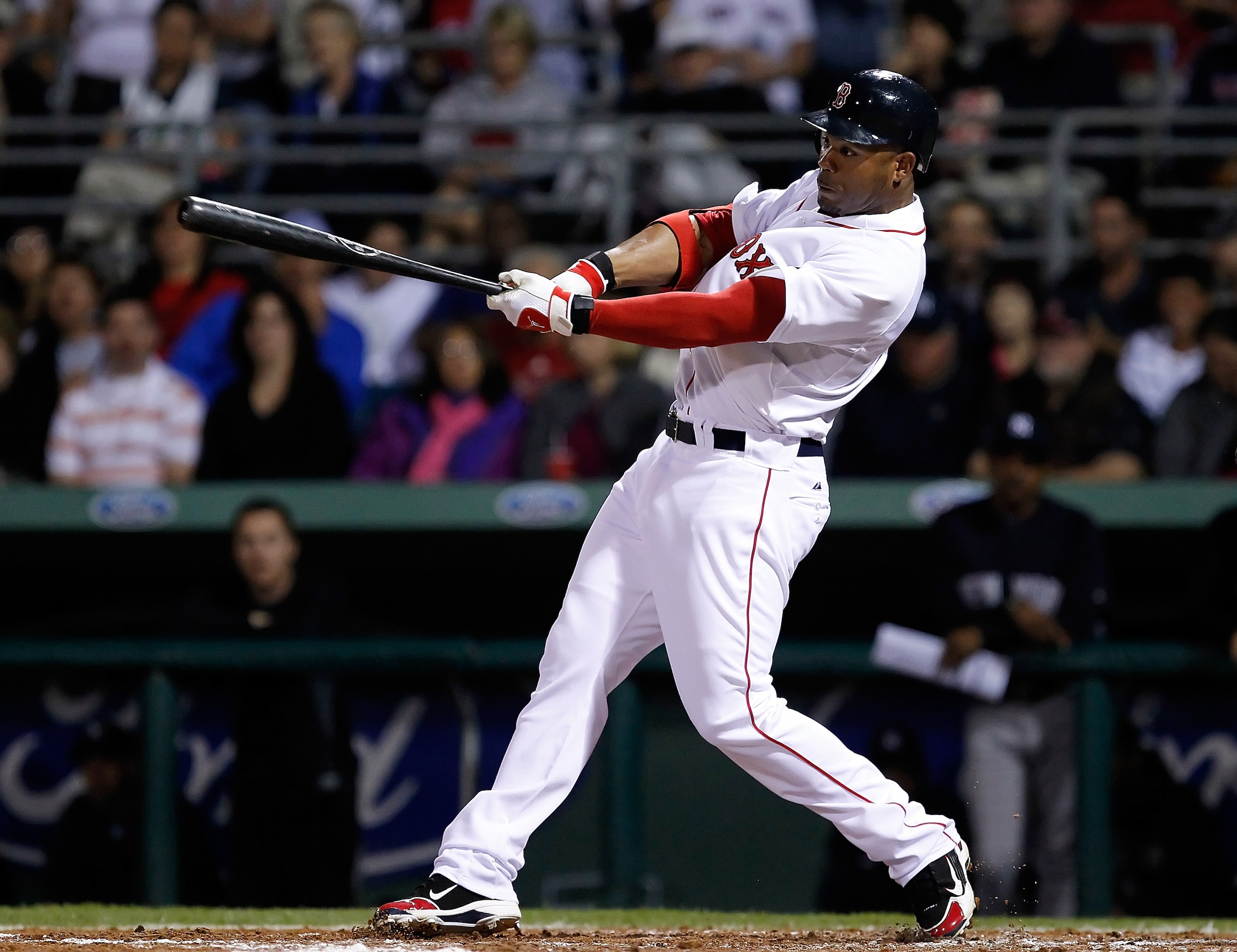 FORT MYERS, FL - MARCH 14: Outfielder Carl Crawford #13 of the Boston Red Sox fouls off a pitch against the New York Yankees during a Grapefruit League Spring Training Game at City of Palms Park on March 14, 2011 in Fort Myers, Florida. (Photo by J. Mer FORT MYERS, FL - MARCH 14: Outfielder Carl Crawford #13 of the Boston Red Sox fouls off a pitch against the New York Yankees during a Grapefruit League Spring Training Game at City of Palms Park on March 14, 2011 in Fort Myers, Florida. (Photo by J. Mer