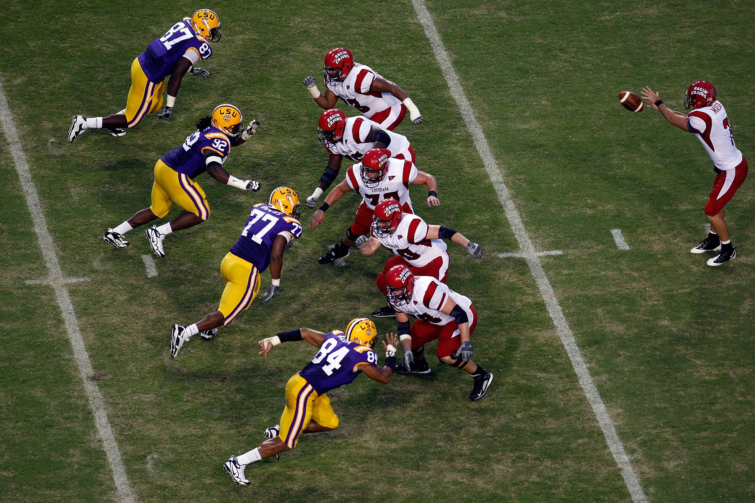 BATON ROUGE, LA - SEPTEMBER 19: Quarterback Chris Masson #7 of the University of Louisiana-Lafatette Ragin' Cajuns has the ball snapped to him during the game against the Louisiana State University Tigers at Tiger Stadium on September 19, 2009 in Baton R BATON ROUGE, LA - SEPTEMBER 19: Quarterback Chris Masson #7 of the University of Louisiana-Lafatette Ragin' Cajuns has the ball snapped to him during the game against the Louisiana State University Tigers at Tiger Stadium on September 19, 2009 in Baton R