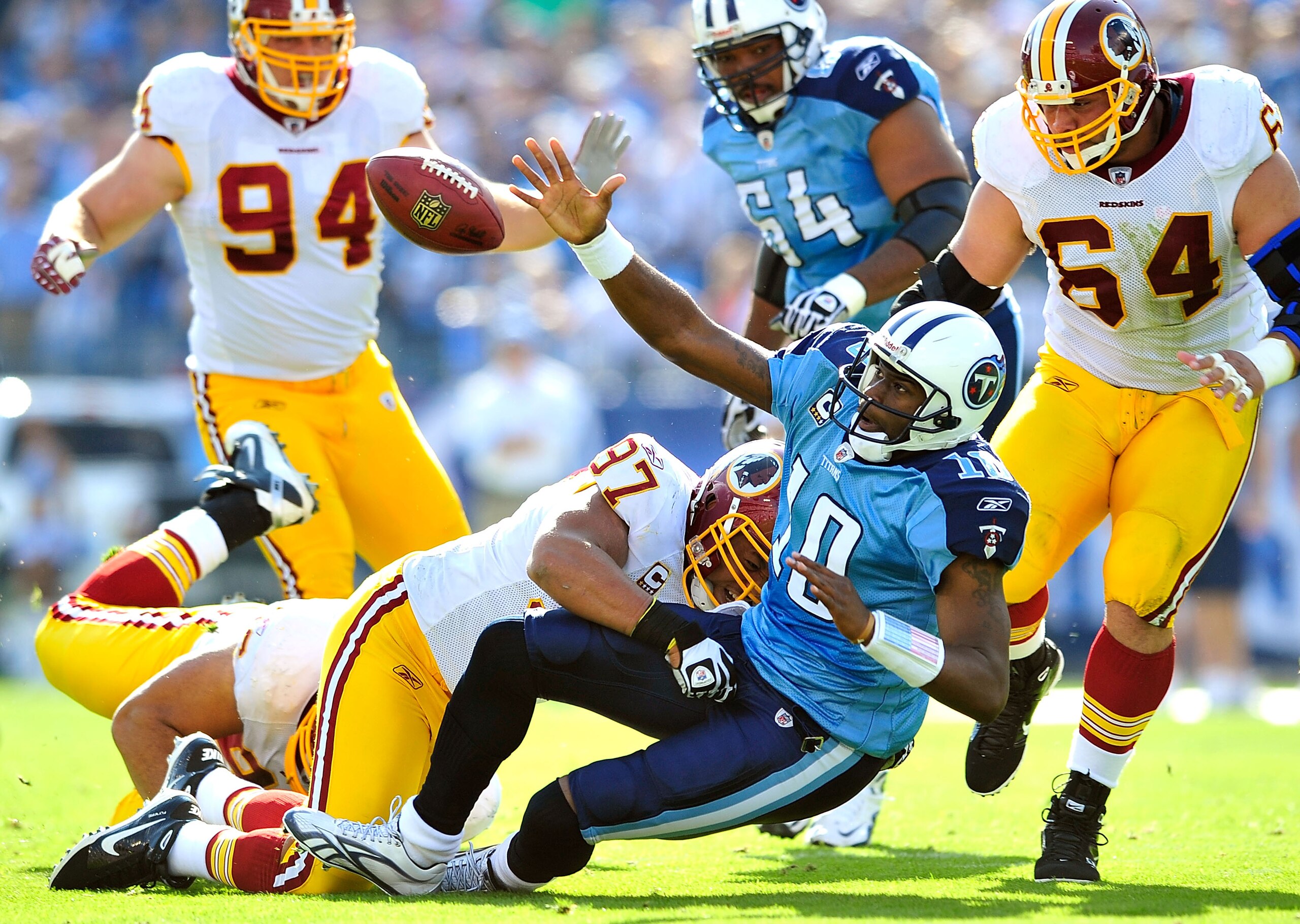 NASHVILLE, TN - NOVEMBER 21:  Lorenzo Alexander #97 of the Washington Redskins forces a fumble by quarterback Vince Young #10 of the Tennessee Titans during the first half at LP Field on November 21, 2010 in Nashville, Tennessee.  (Photo by Grant Halverso