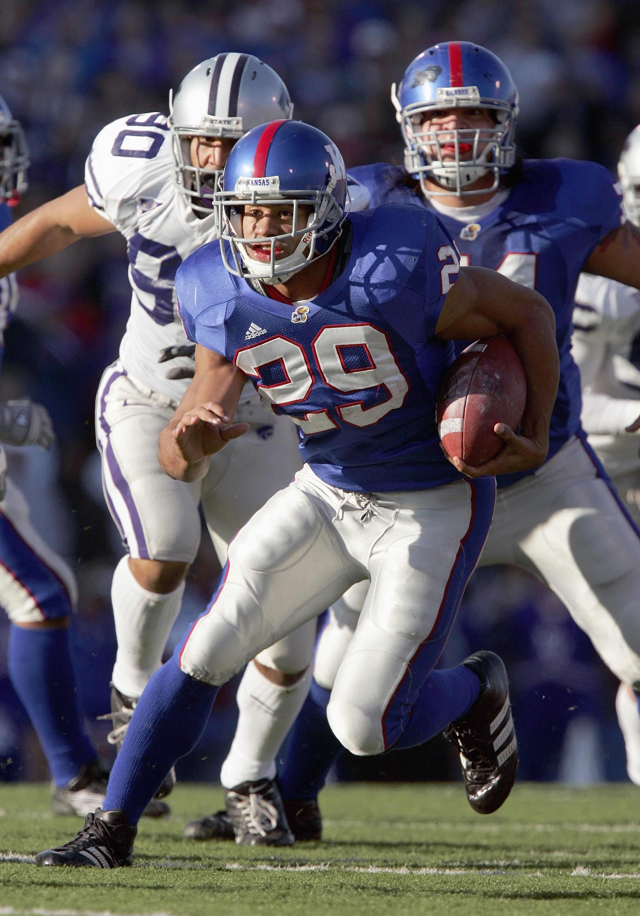 LAWRENCE, KS - NOVEMBER 18: Jon Cornish #29 of the Kansas Jayhawks carries the ball during the game against the Kansas State Wildcats at Memorial Stadium on November 18, 2006 in Lawrence, Kansas. The Kansas Jayhawks won 39-20. (Photo by Brian Bahr/Getty I