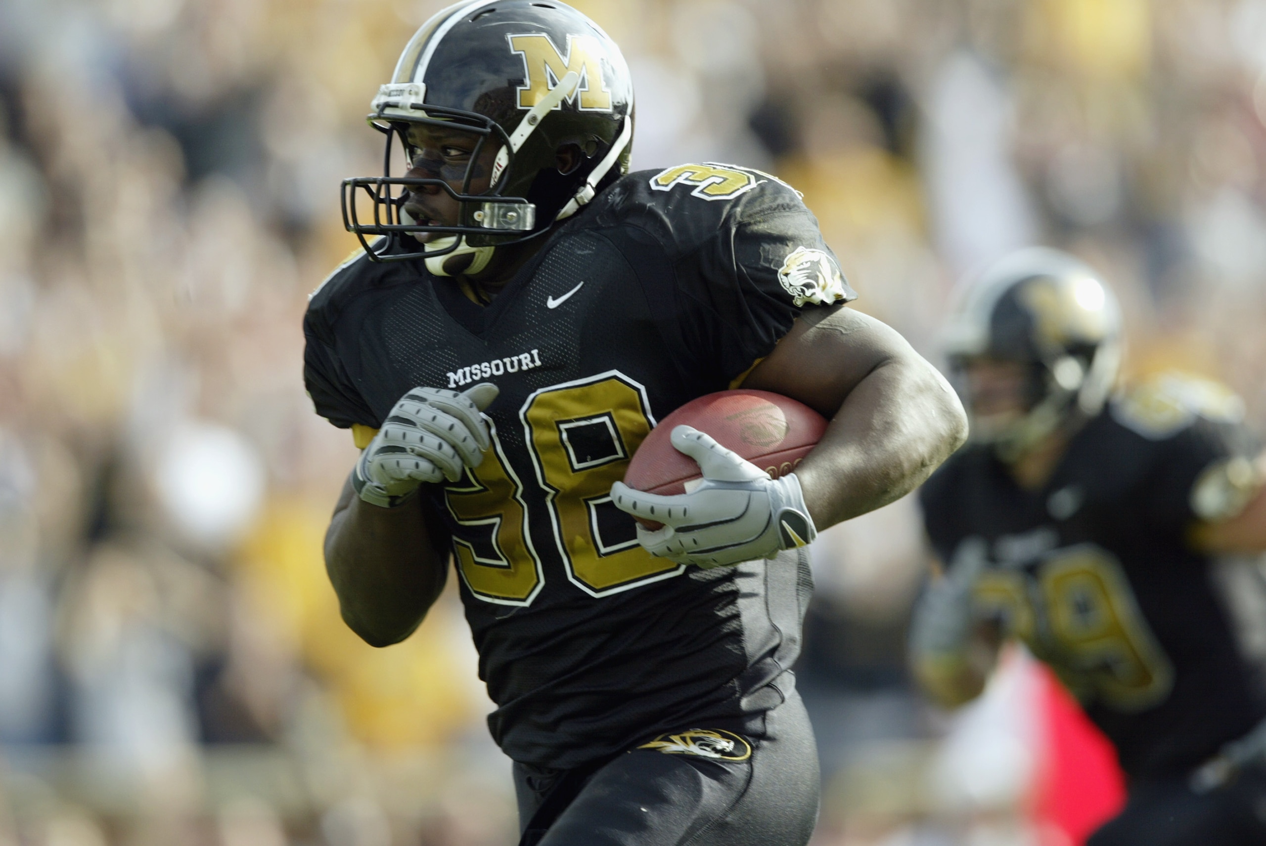 COLUMBIA, MO - NOVEMBER 9:  Zack Abron #38 of the Missouri Tigers breaks away for a touchdown run during the Big 12 Conference football game against the Colorado Buffaloes at Faurot Field on November 9, 2002 in Columbia, Missouri.  The Buffaloes won 42-35