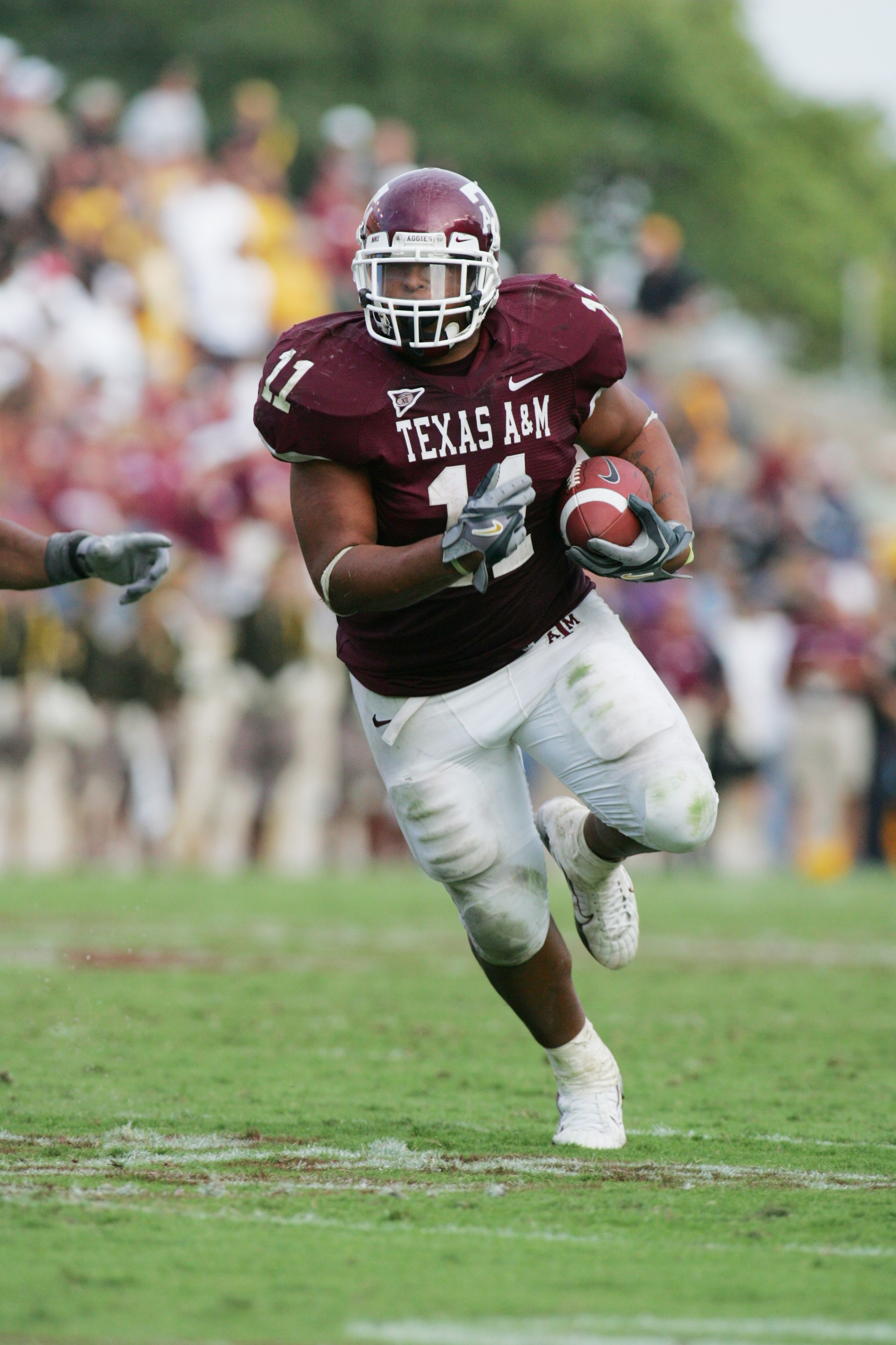 COLLEGE STATION, TX - OCTOBER 14:  Running back Jorvorskie Lane #11 of the Texas A&M Aggies carries the ball against the Missouri Tigers at Kyle Field on October 14, 2006 in College Station, Texas. Texas A&M won 25-19. (Photo by Ronald Martinez/Getty Imag