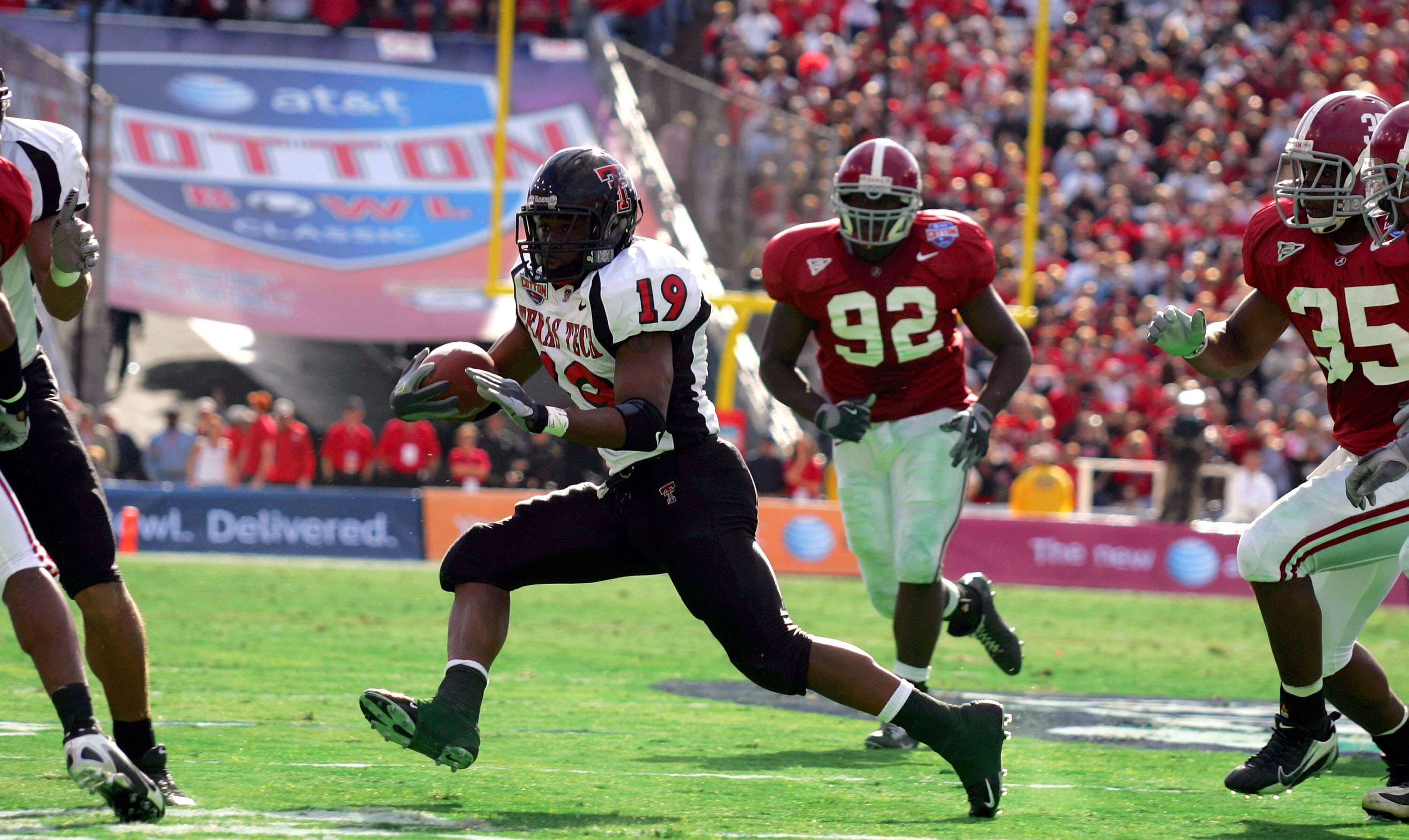DALLAS - JANUARY 2:  Running back Taurean Henderson #19 of the Texas Tech Red Raiders runs the ball against the Alabama Crimson Tide during the AT&T Cotton Bowl on January 2, 2006 at the Cotton Bowl in Dallas, Texas. The Crimson Tide defeated the Red Raid