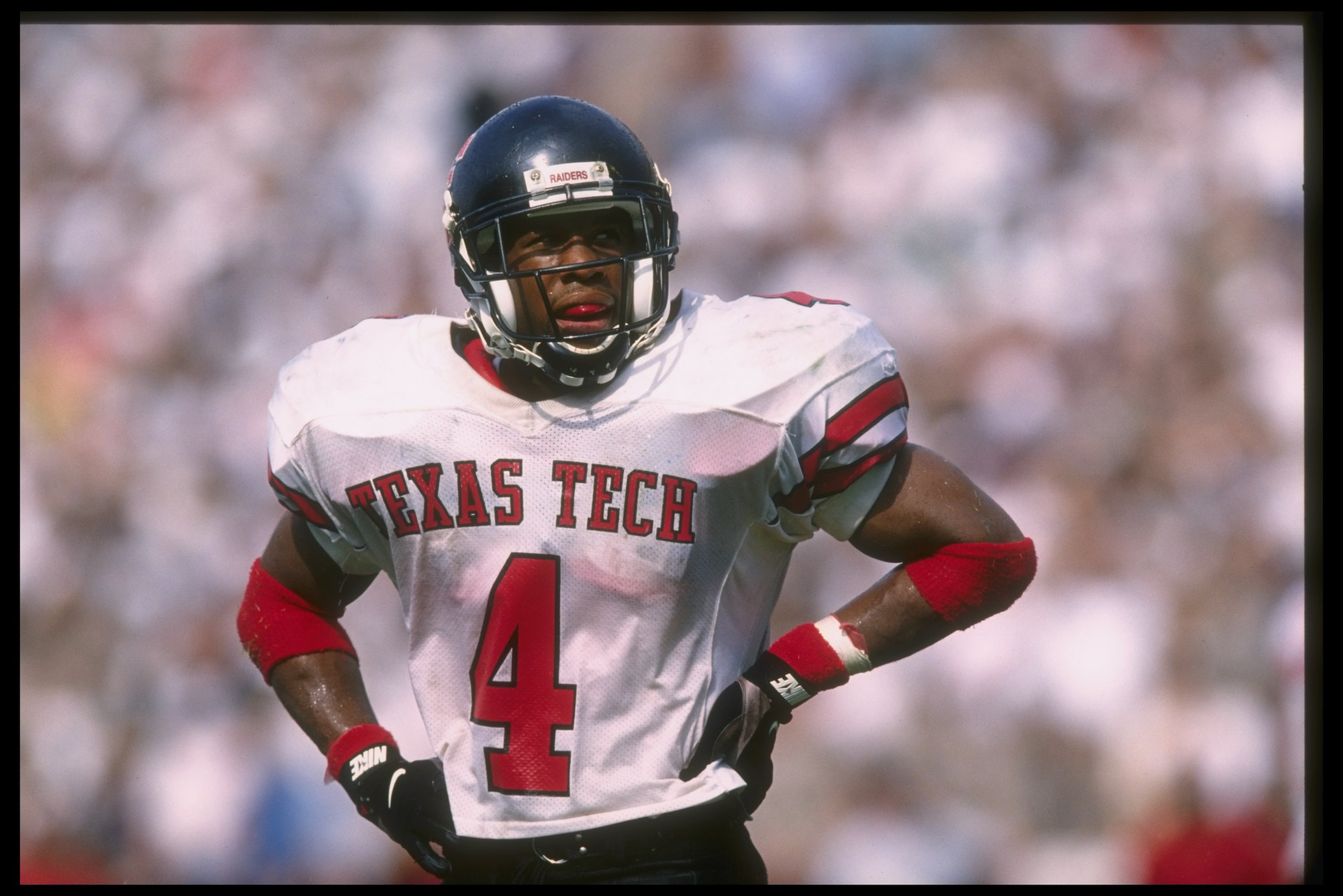 26 Oct 1996: Running back Byron Hanspard #4 of the Texas Tech Red Raiders looks to the sideline as he takes an opportunity to rest during a break in the action of the Red Raiders 13-10 victory over the Texas A&M Aggies at Lyons Field in College Station, T