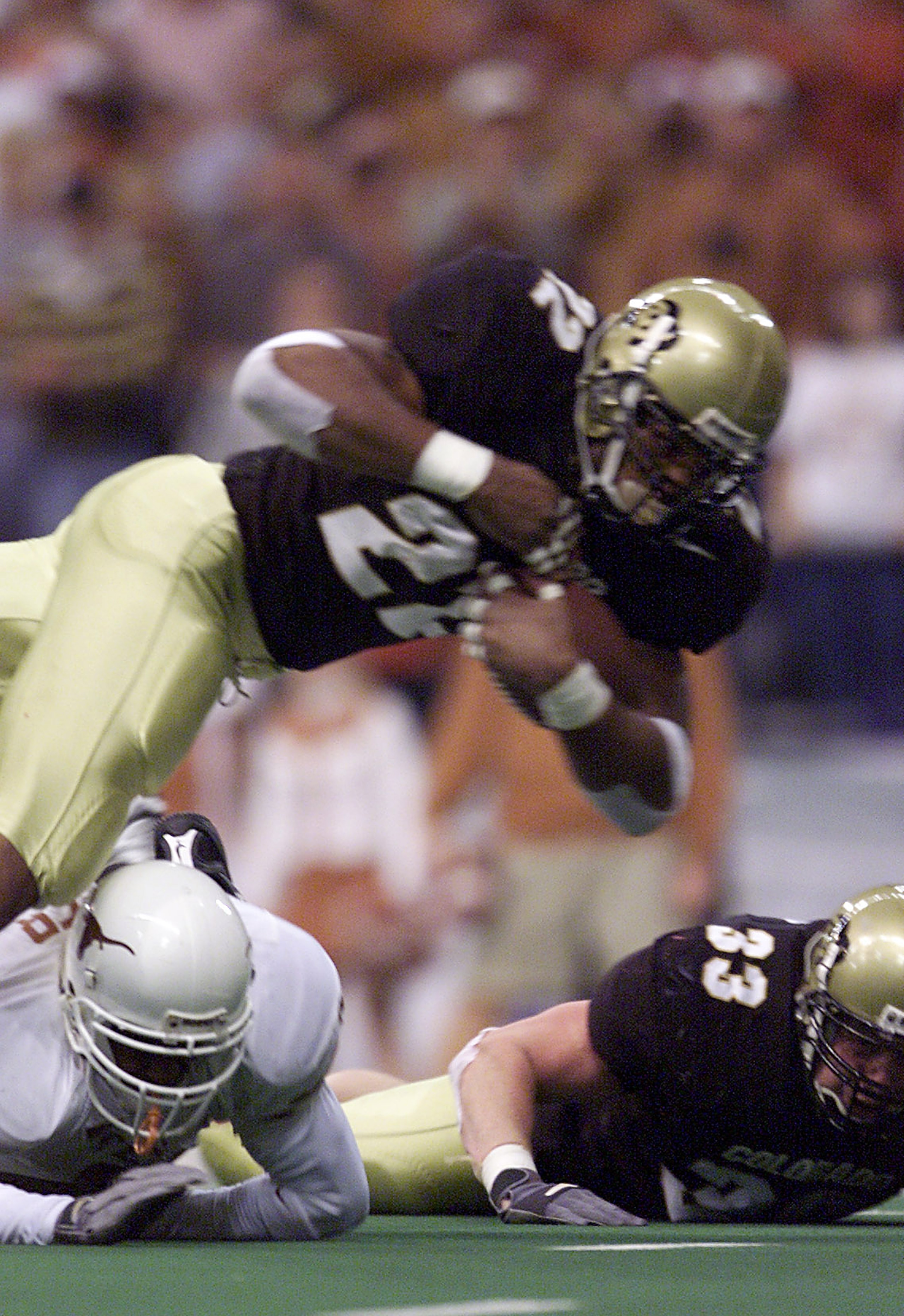 01 Dec 2001:   Tailback Chris Brown #22 of the Colorado Buffaloes dives into the endzone for a touchdown against the Texas Longhorns in the first quarter of the Big 12 Championship at Texas Stadium in Irving, Texas.  DIGITAL IMAGE Mandatory Credit: Brian 