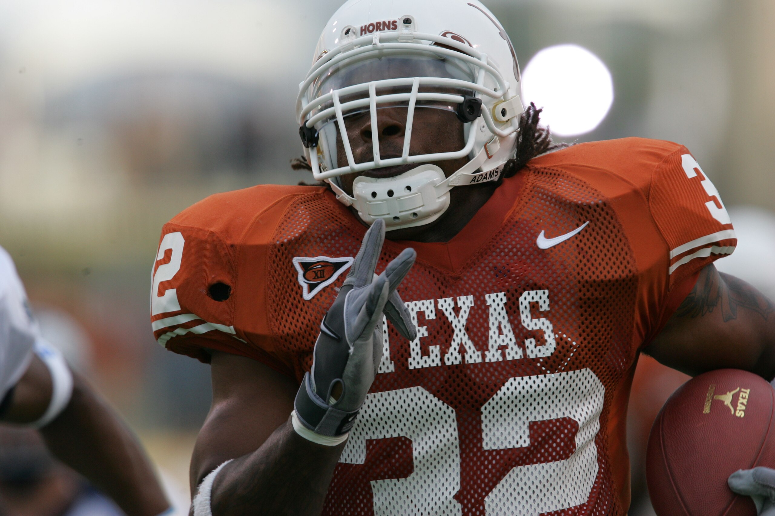 AUSTIN, TX - SEPTEMBER 25:  Running back Cedric Benson #32 of the University of Texas at Austin Longhorns carries the ball against the Rice University Owls during the game on September 25, 2004 at Royal-Memorial Stadium in Austin, Texas.  Texas won 35-13.