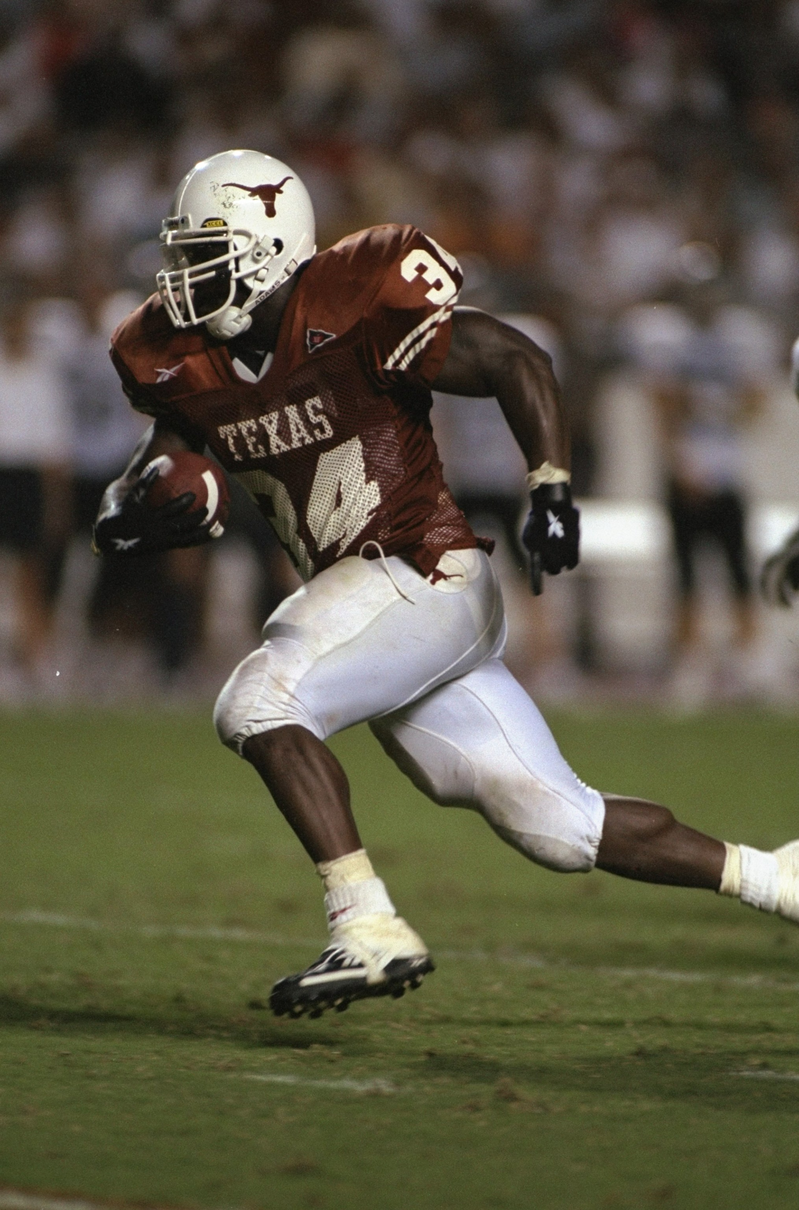 26 Sep 1998:  Running back Ricky Williams #34 of the Texas Longhorns in action during the game against the Rice Owls at the Texas Memorial Stadium in Austin, Texas. The Longhorns defeated the Owls 59-21. Mandatory Credit: Chris Covatta  /Allsport